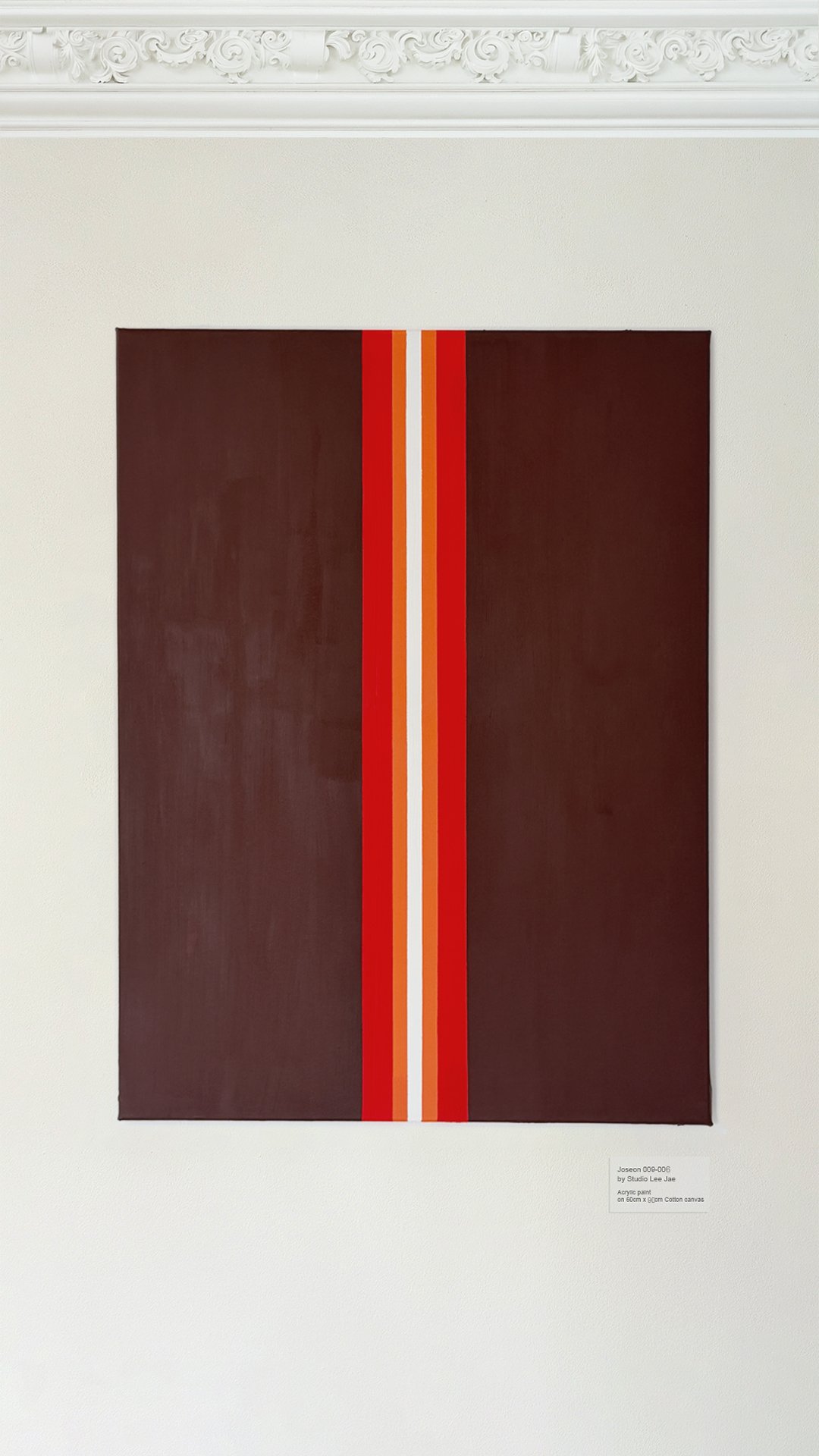 An abstract painting titled 'Jeseon 009-006' by Studio Lee Jae, created with acrylic paint on 600cm by 900cm cotton canvas. The artwork features a dark brown background with a central vertical stripe pattern in red, orange, and white colors.