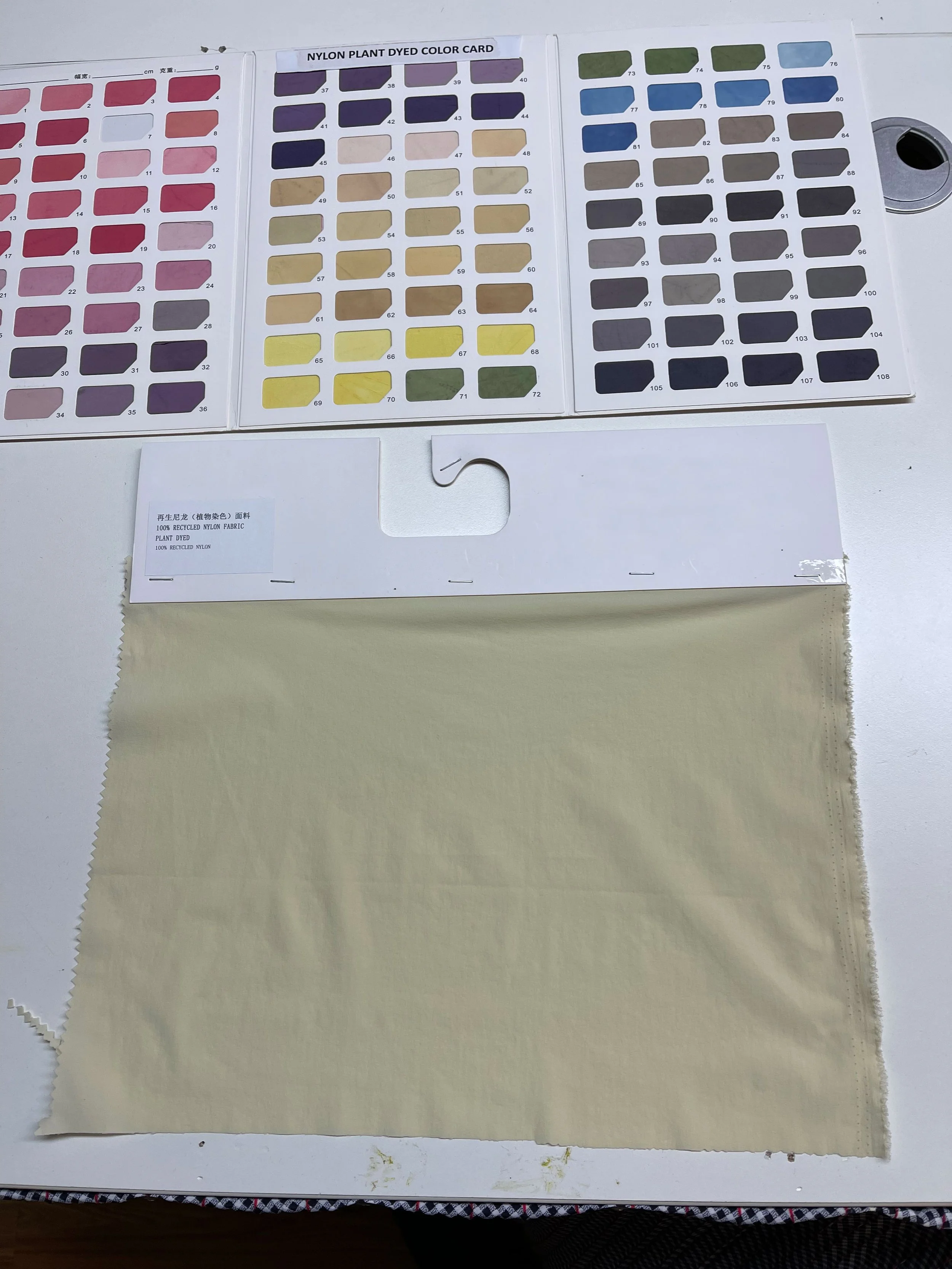 Color swatch with fabric sample and color reference cards for dyed nylon fabric.