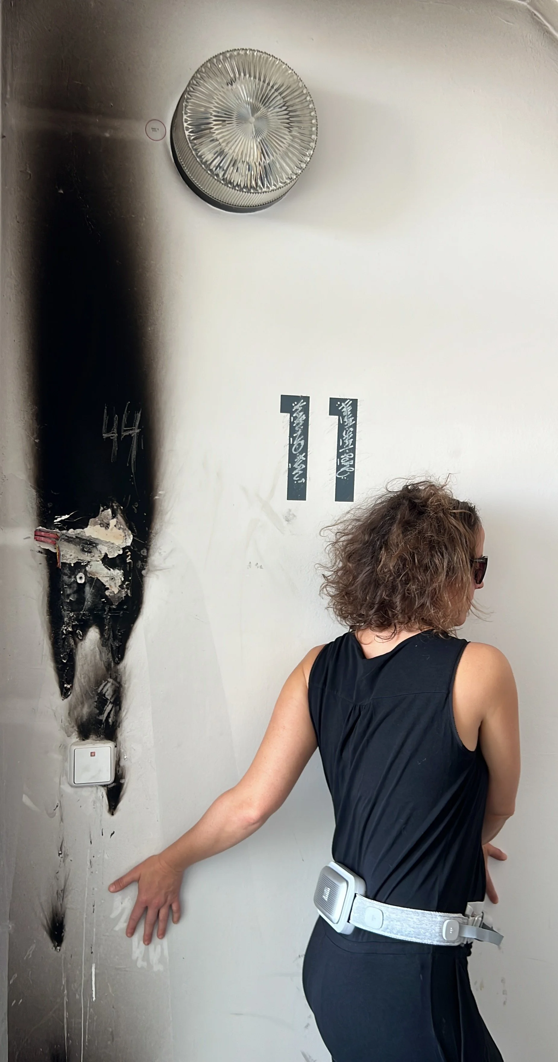 Marina Dessau wearing a bHaptics vest during a tactile experiment exploring sensory information through the body.