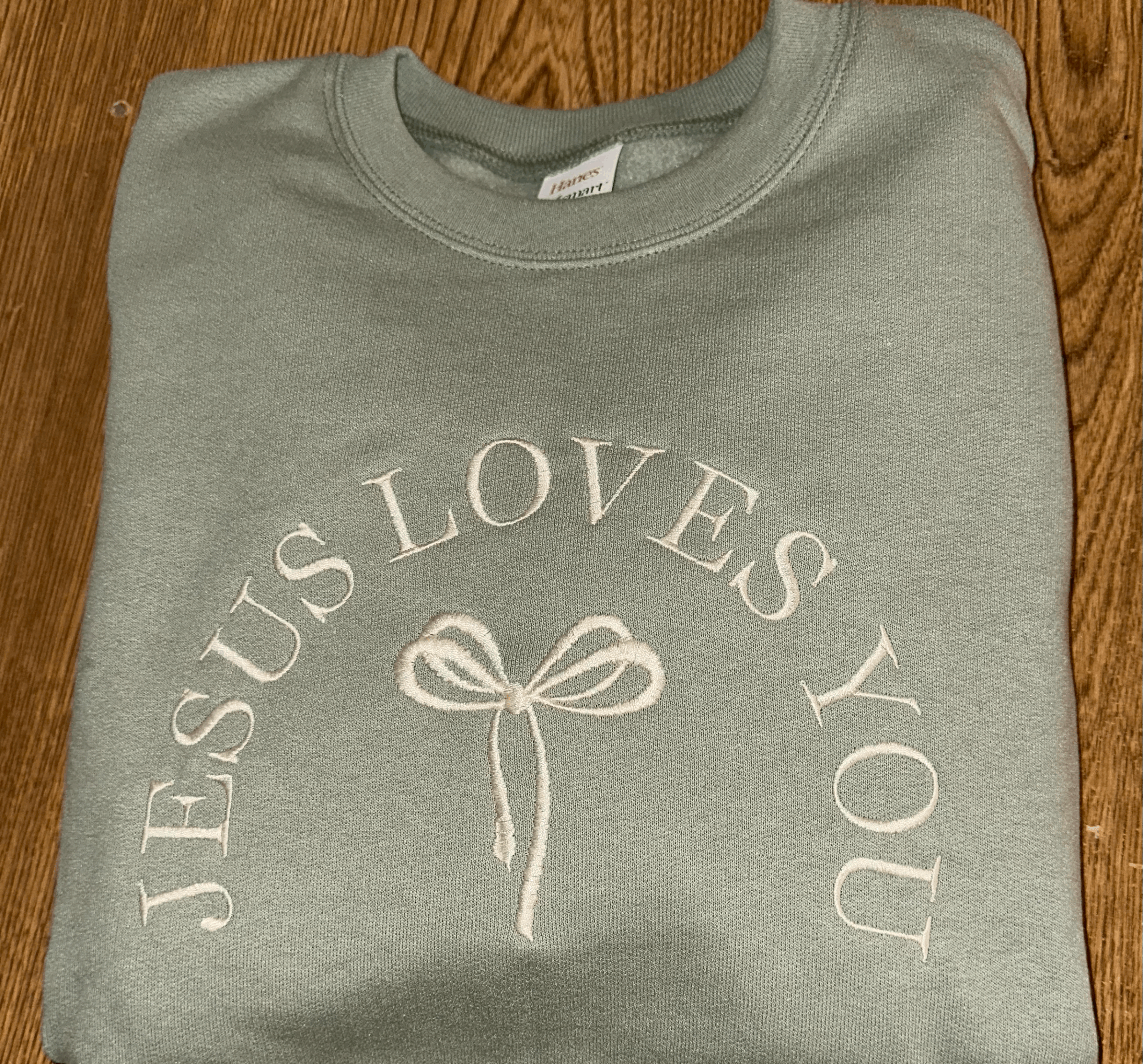 Jesus Loves You Arched Bow Crewneck