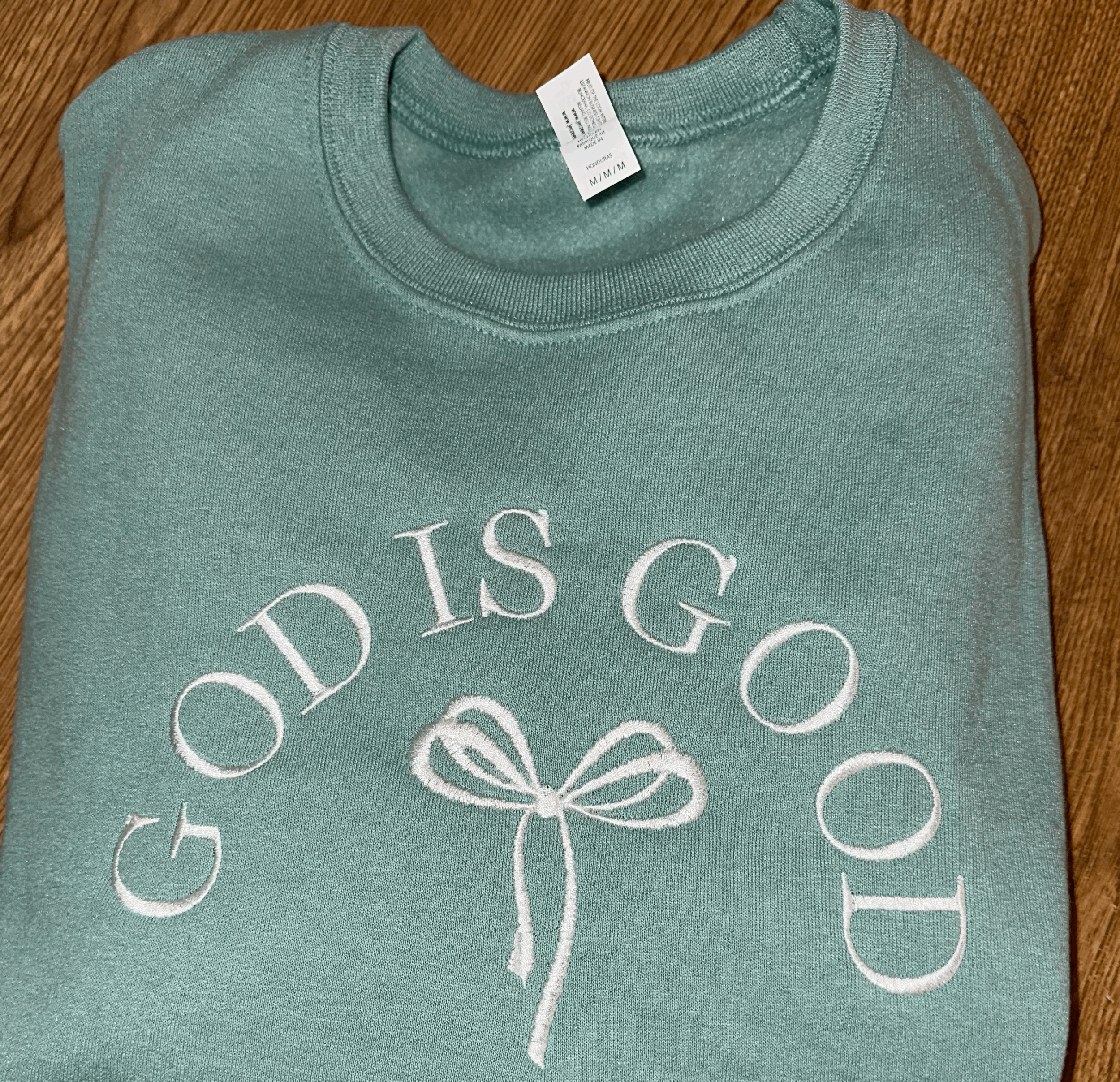 God Is Good Arched Bow Crewneck