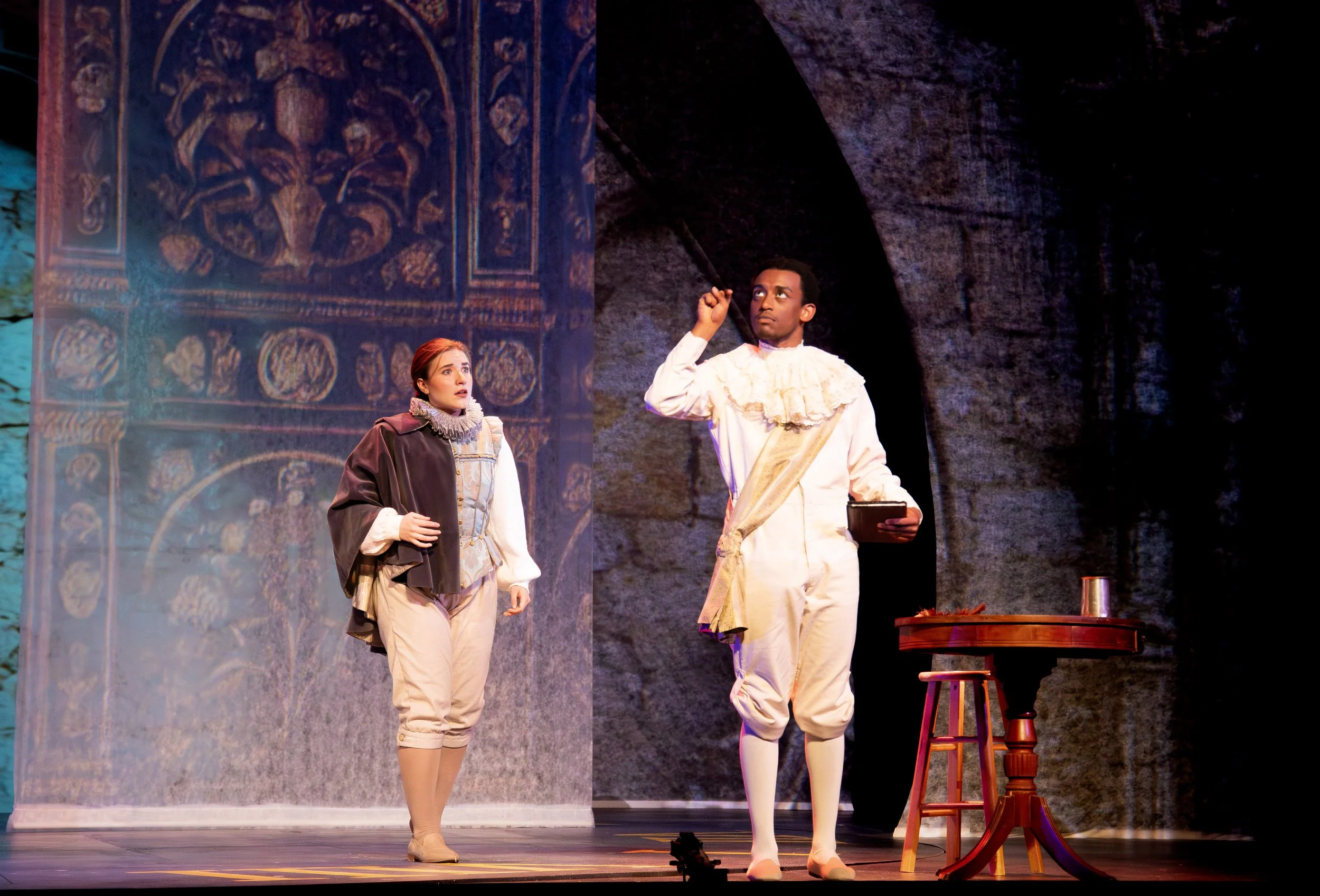 Orlando approaches Shakespeare to ask if he might be a poet.