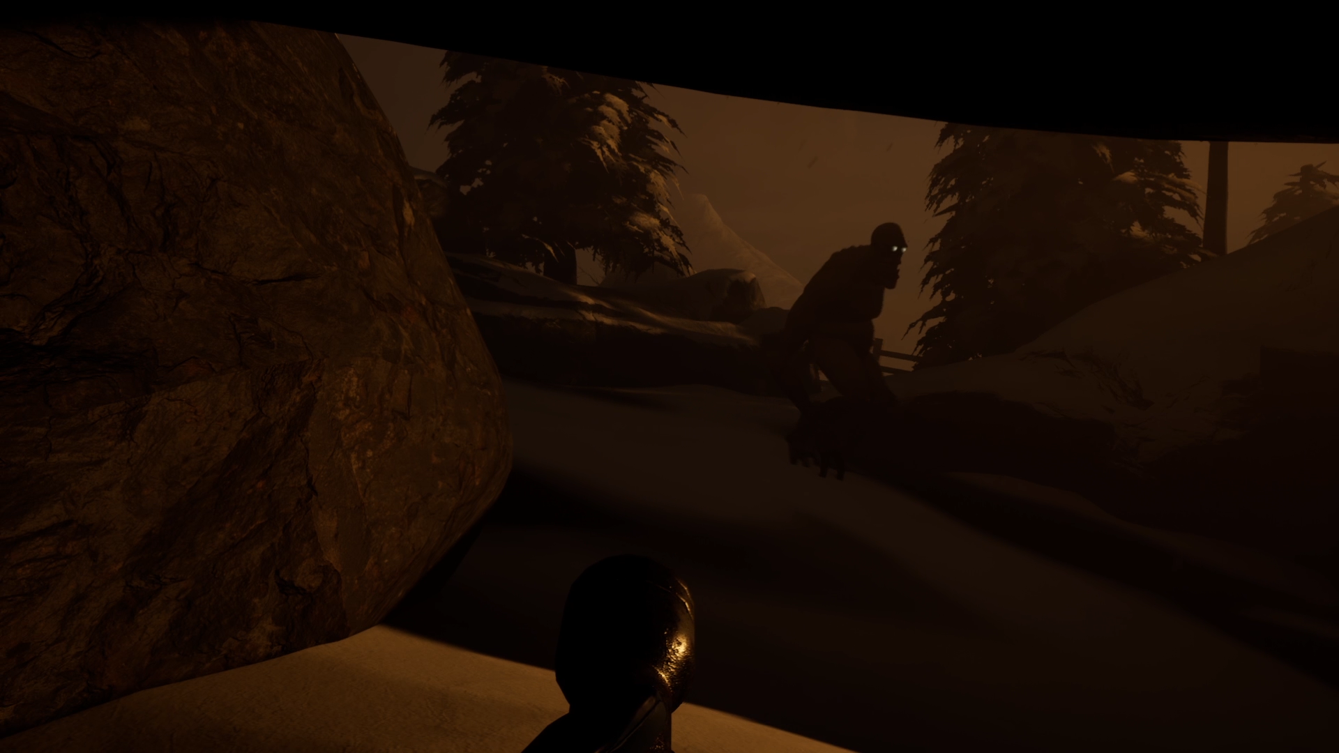 A scene from a video game showing a character hiding in a snowy forest with trees and a large rock, as they face a distant creature with glowing eyes.