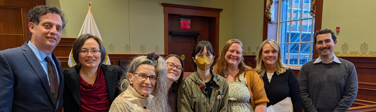 Image of folks who support legislation to have greenhouse gas polluters pay into a fund for climate resilience projects