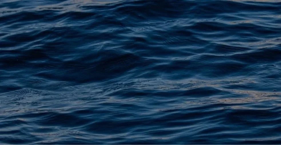 Close-up of blue ocean with gentle waves.