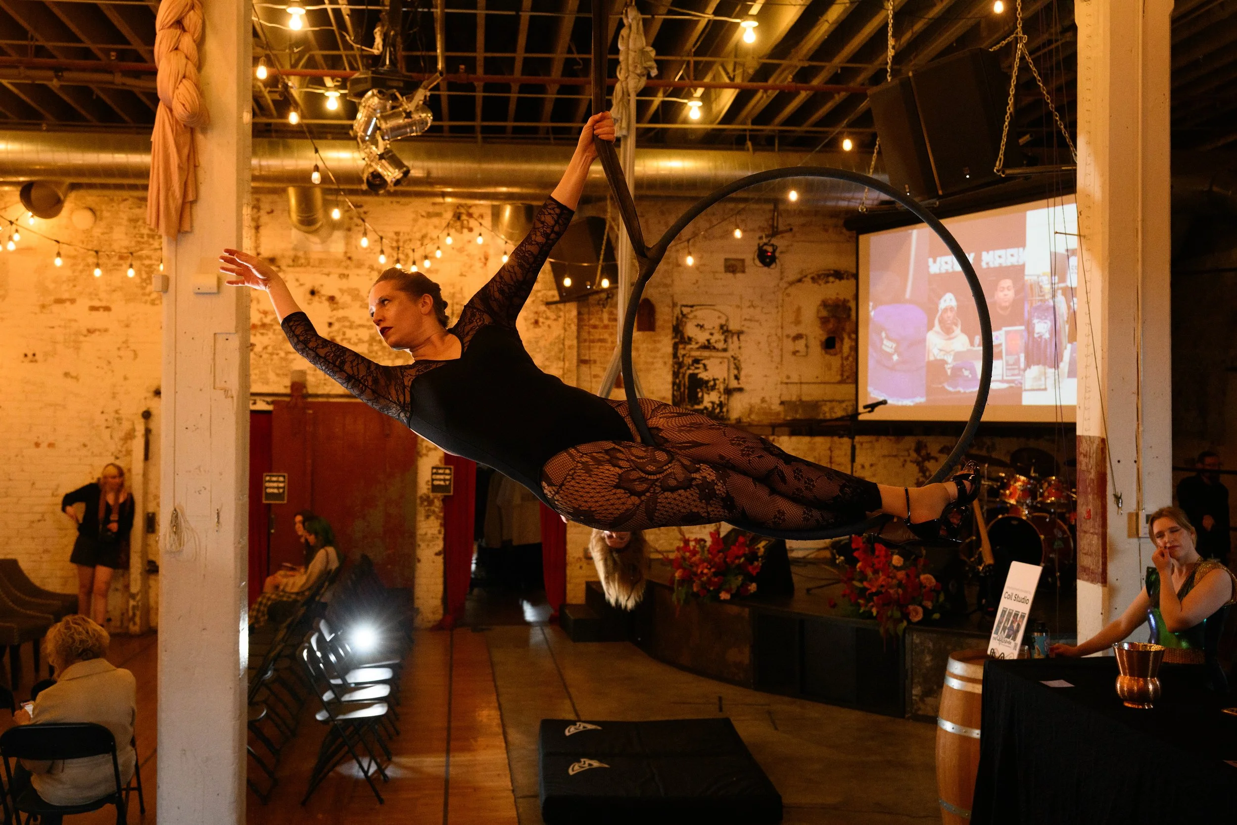 Aerialist and studio owner Melissa Ardales from Coil Studios performing on lyra.