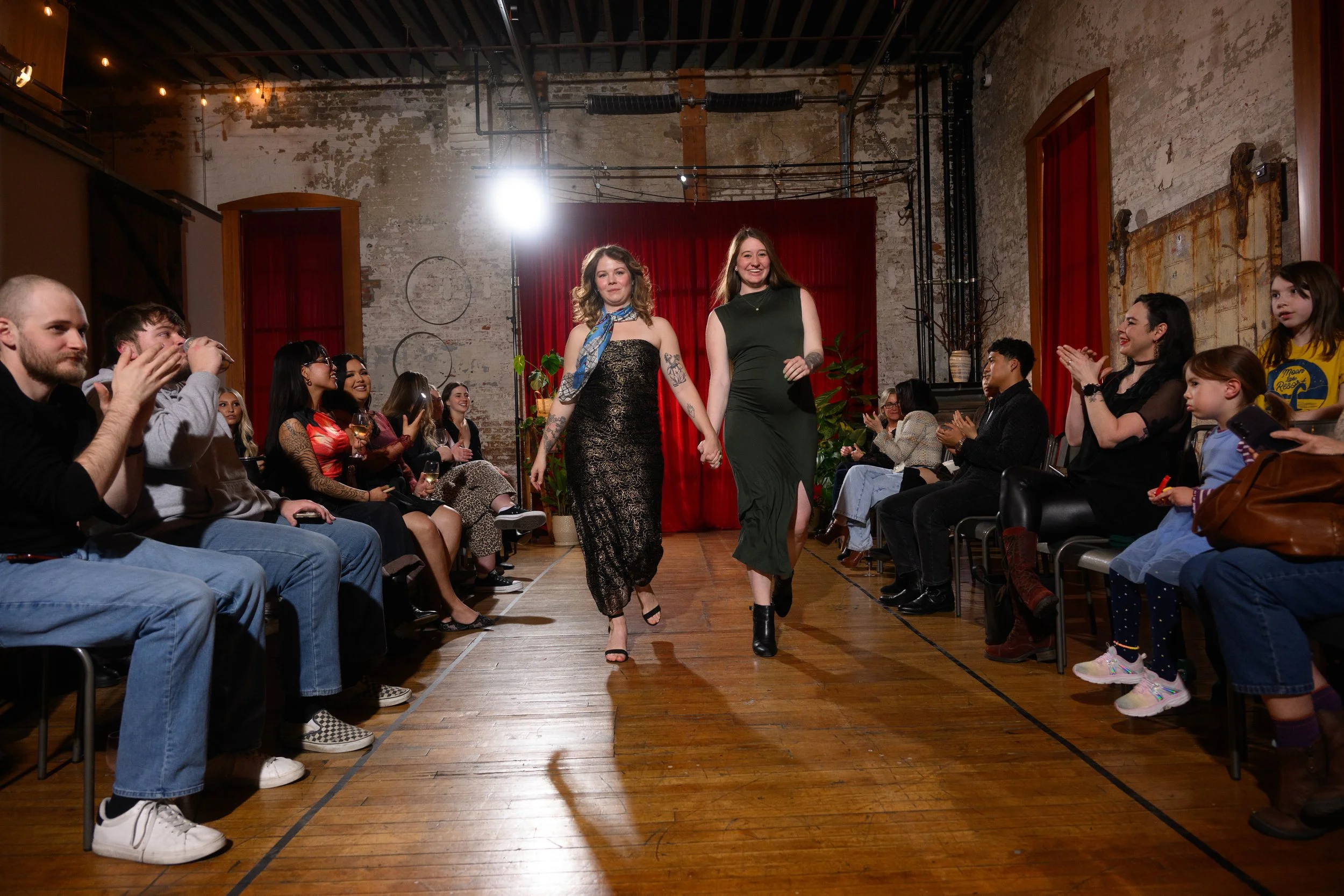 Fashion Week Spokane Co-owners and directions Mackenzie Priest-Nill and Sophia Calhoun join the final walk PC: Scott Martinez