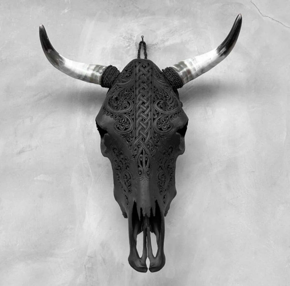 Hand-carved black bull skull - Infinity motif