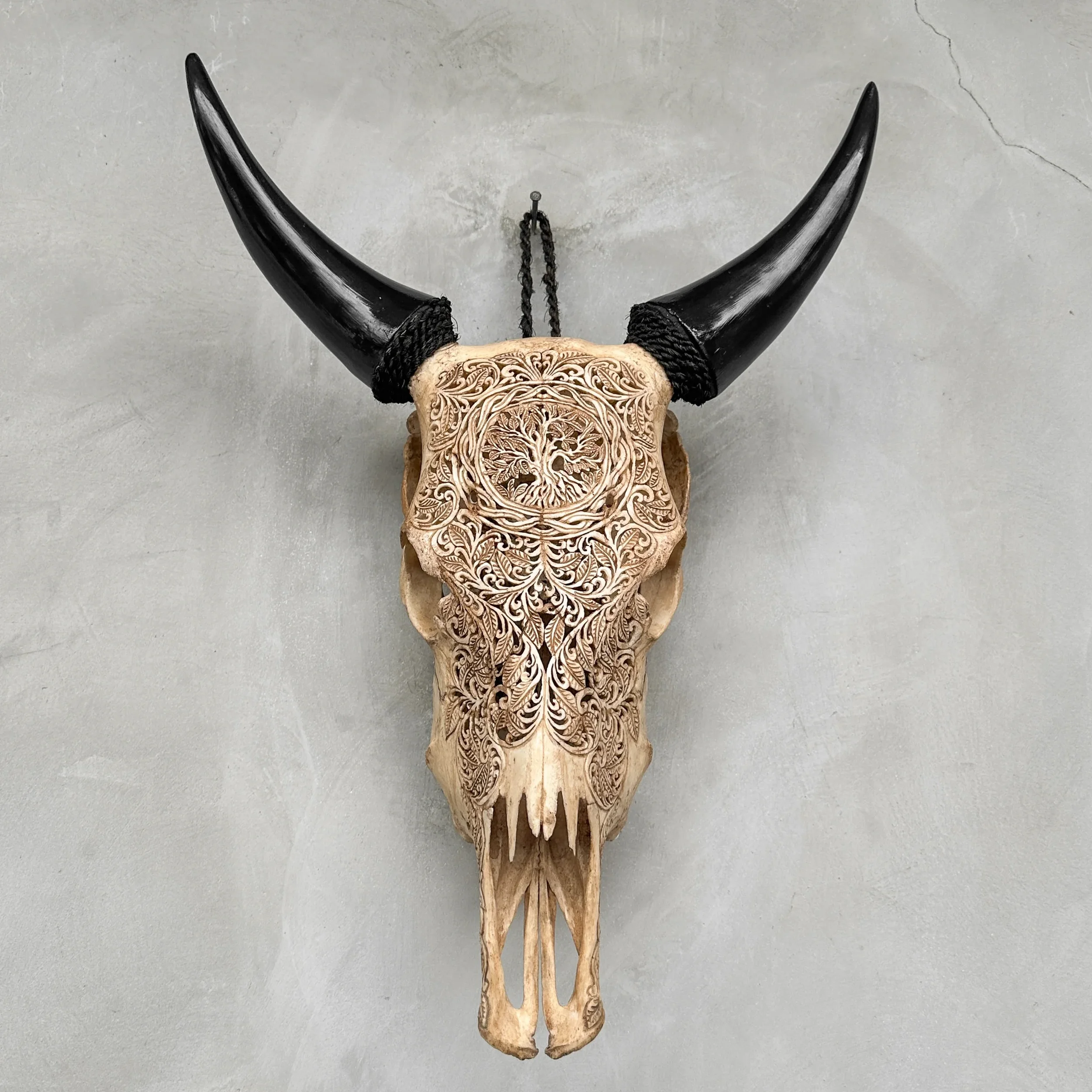 Hand-carved cow skull - tree of life motif