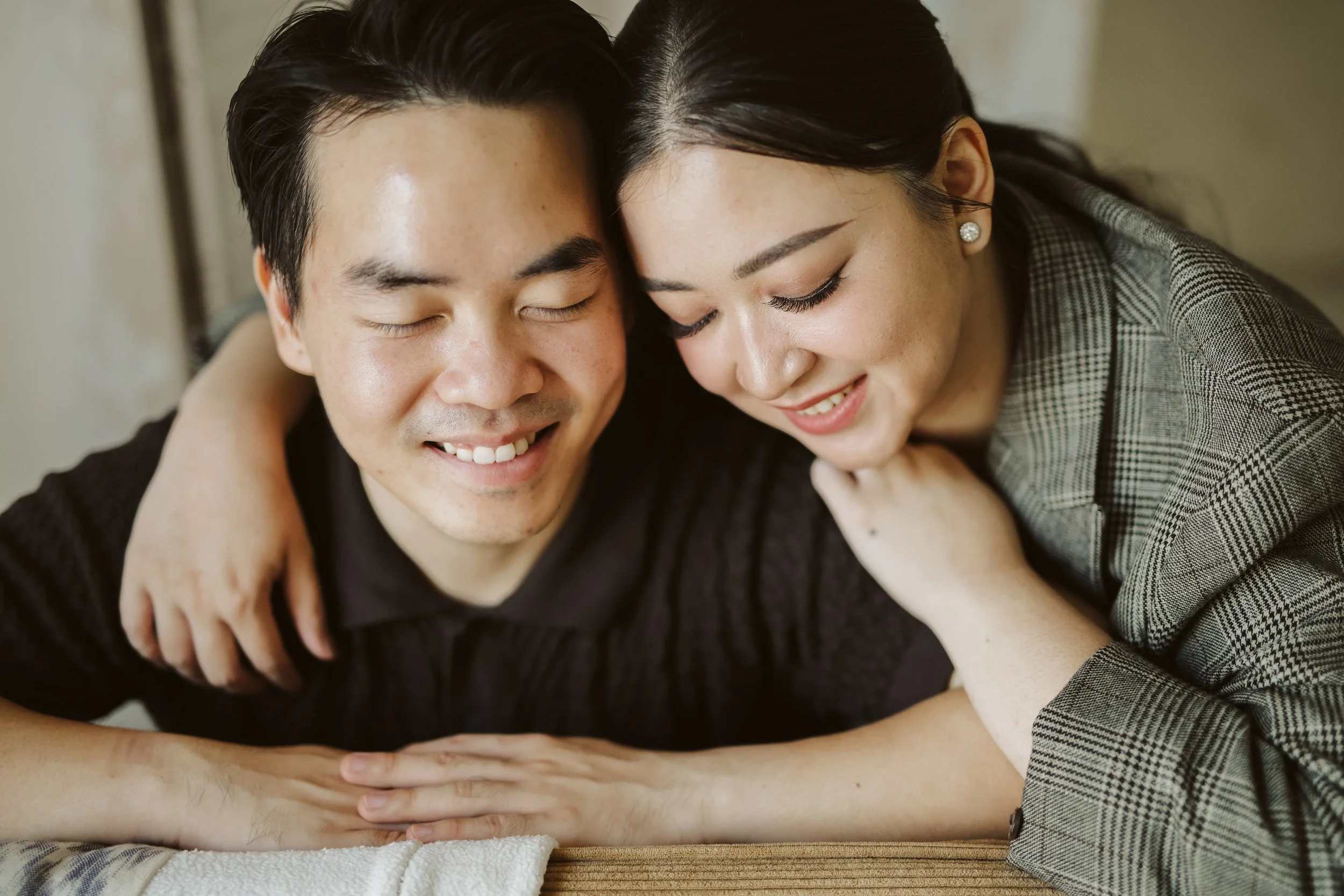 couple with eyes close, embracing