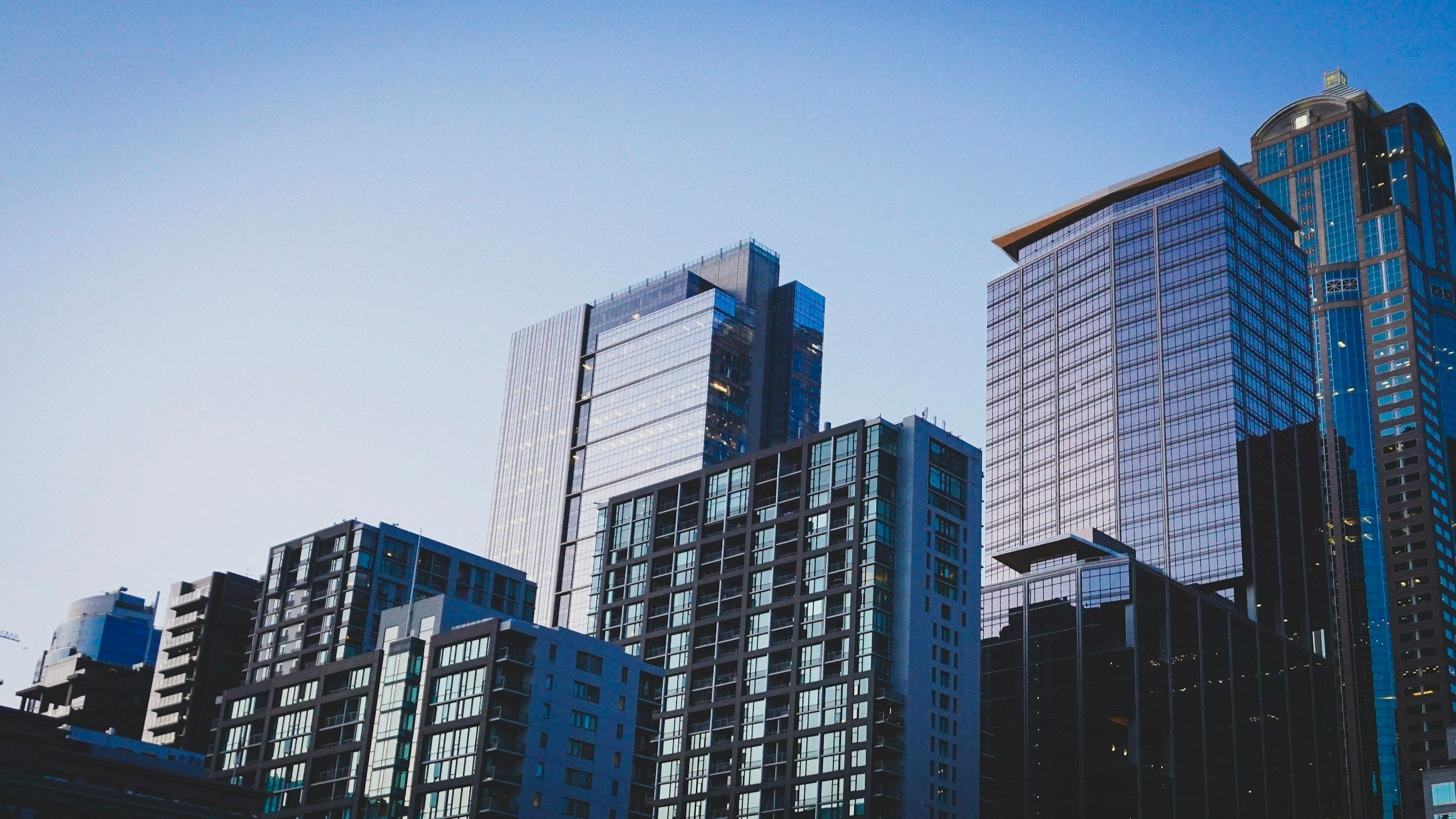 Invest in stocks or real estate? Here's the smart answer
