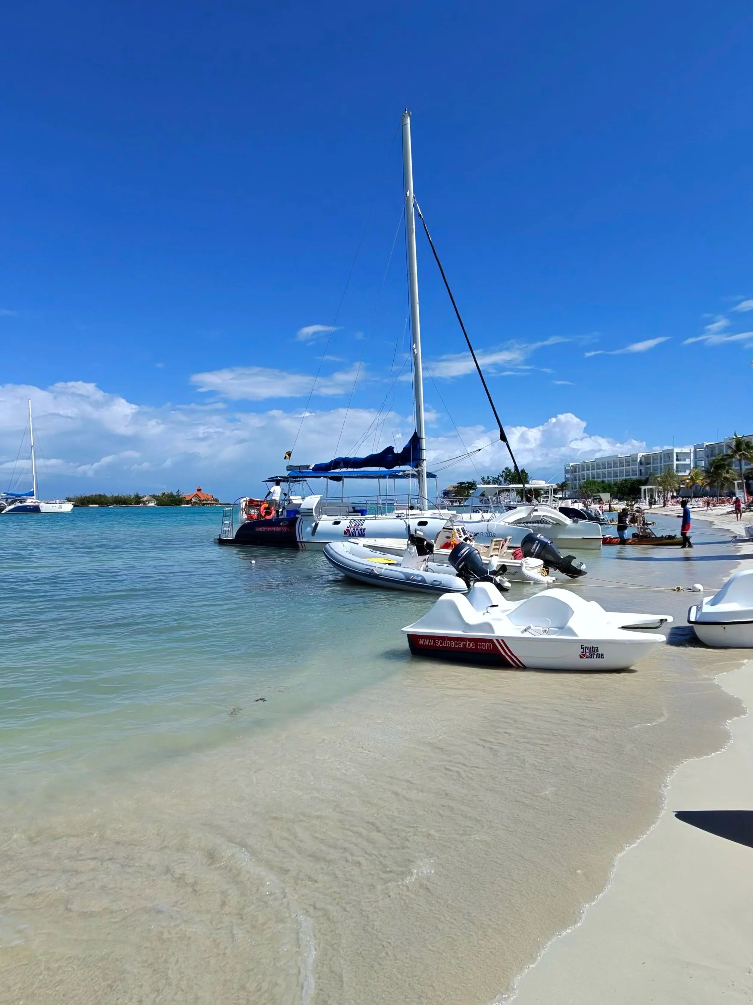 Catamaran and watersports equipment on the beach at Riu Montego Bay in Montego Bay, Jamaica.