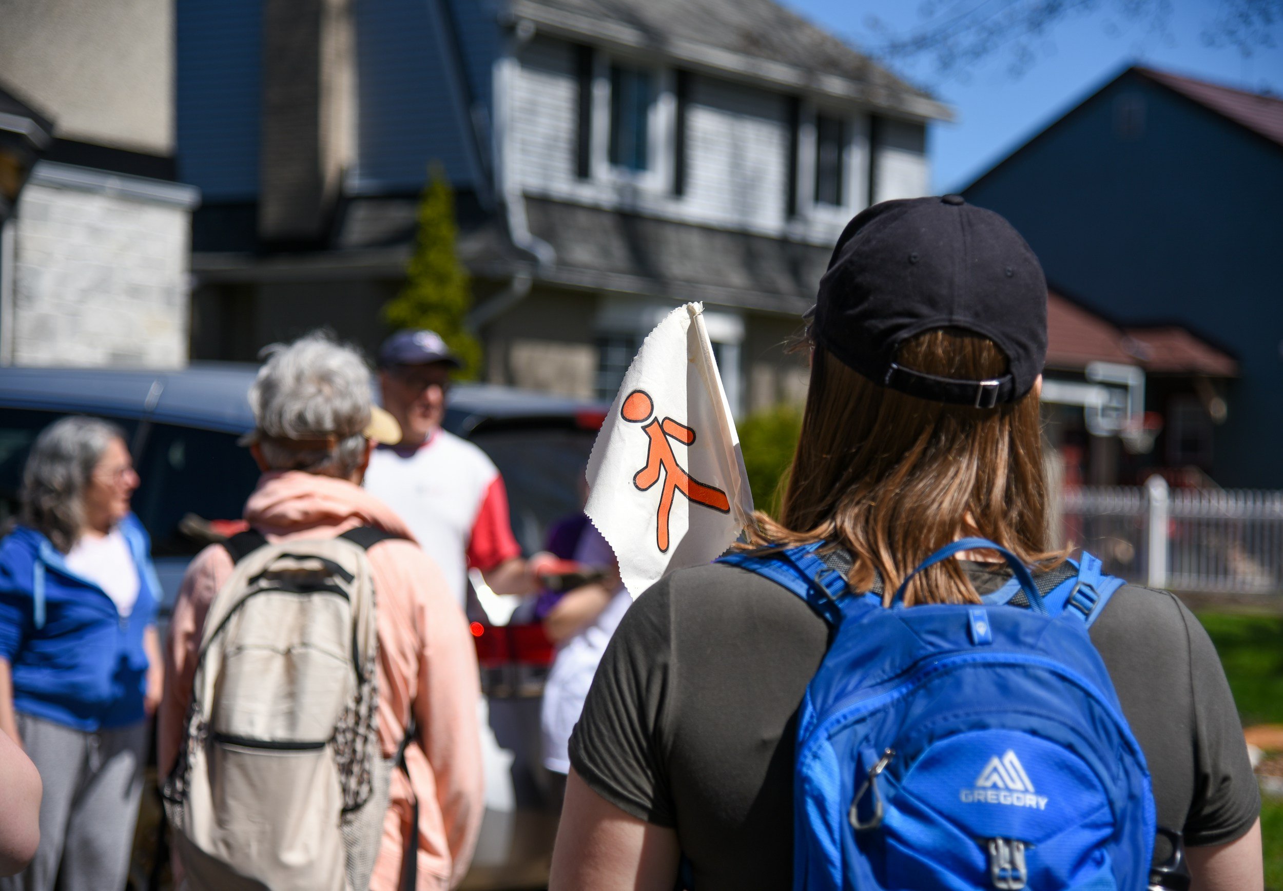 Small group of travelers walking through a city with a local guide