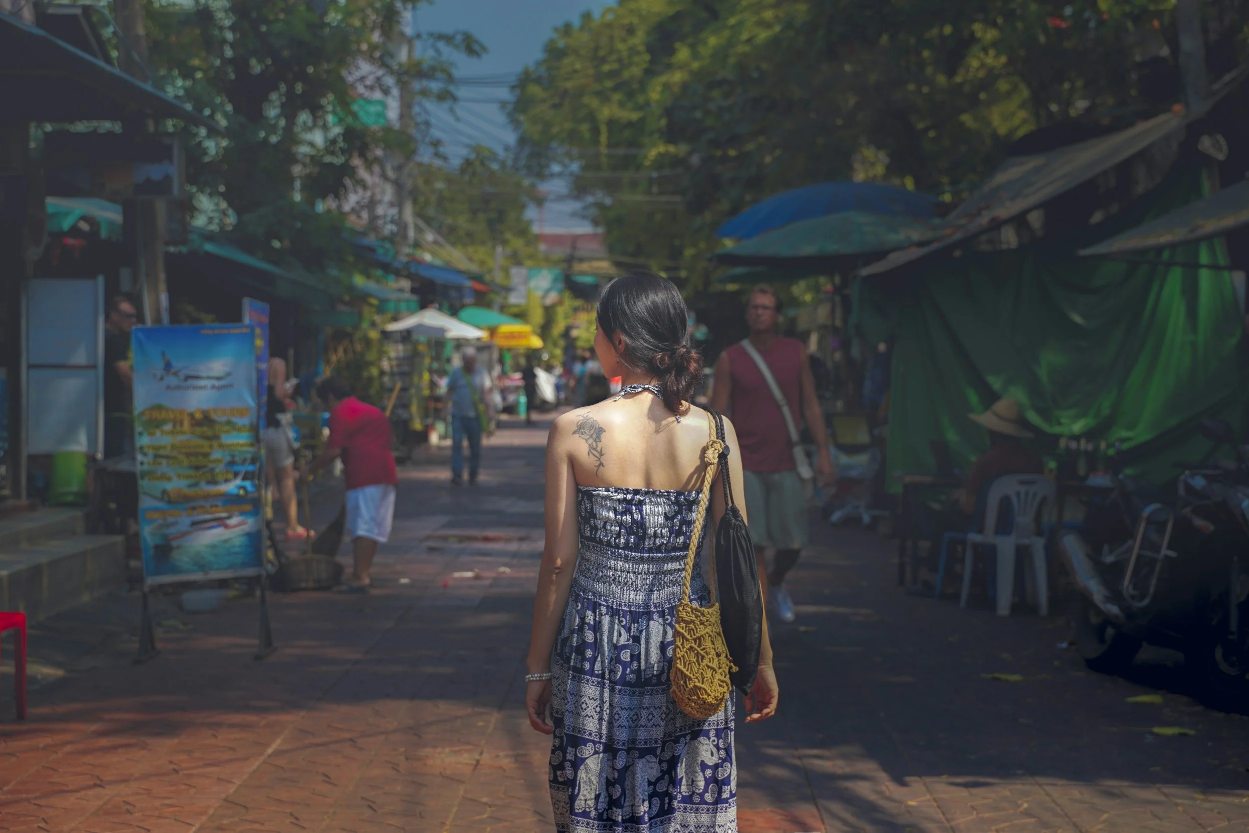 Traveler walking through a local neighborhood street during a culturally immersive travel experience