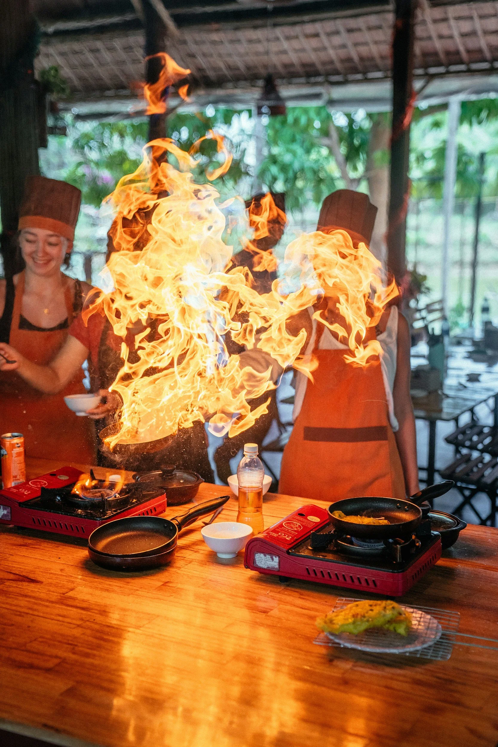 Travelers participating in a local cooking experience as part of immersive cultural travel