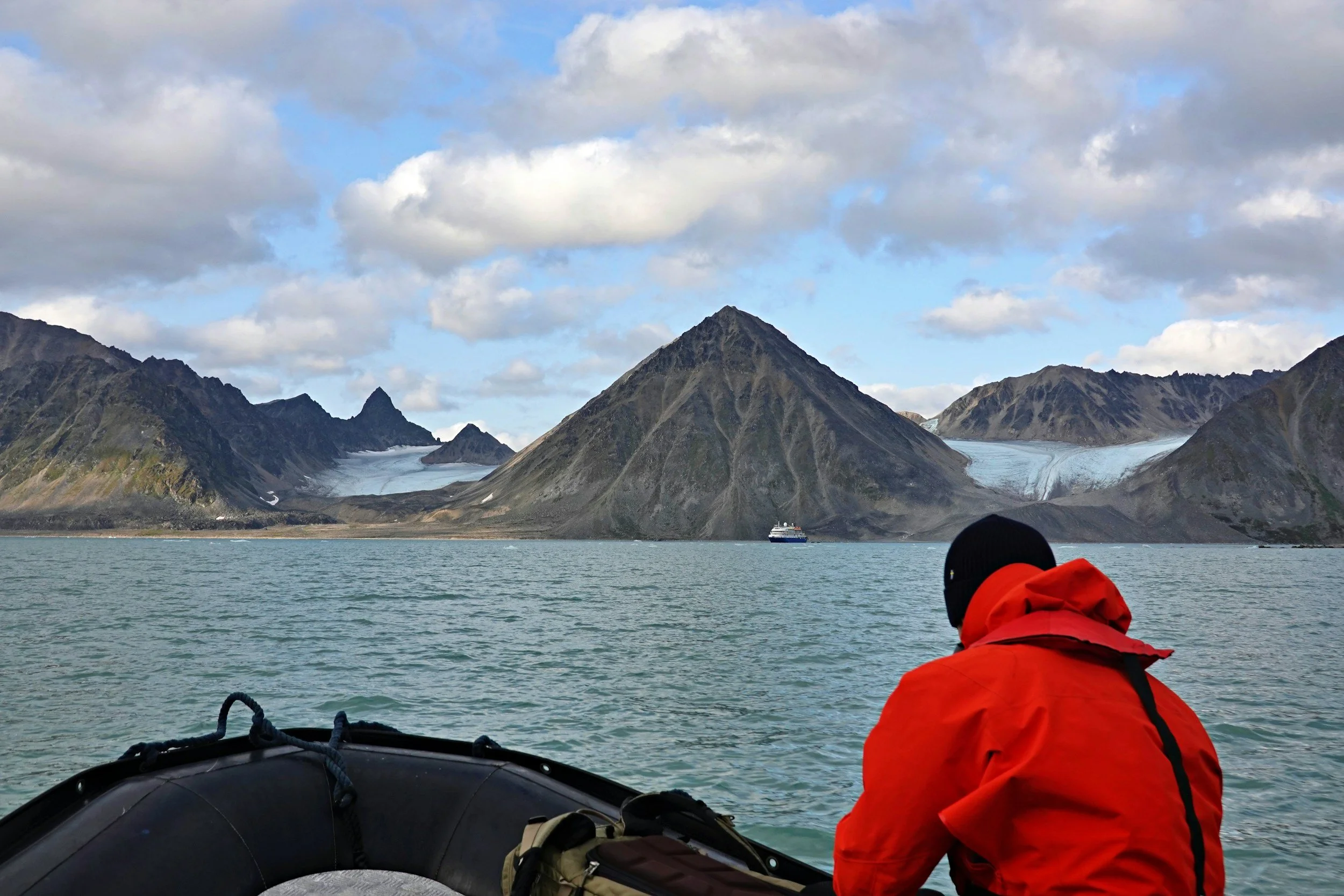 Traveler exploring remote coastal landscapes during an expedition-style cruise experience