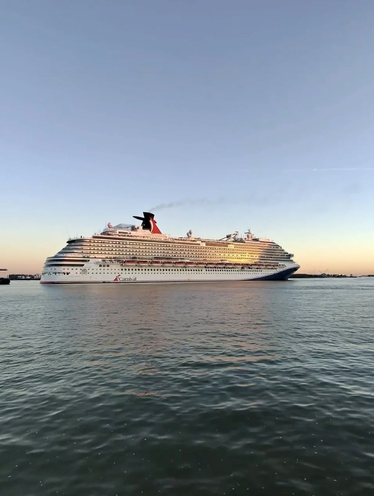 Carnival Dream backing into port in Galveston Texas assisted by pilot boat during arrival