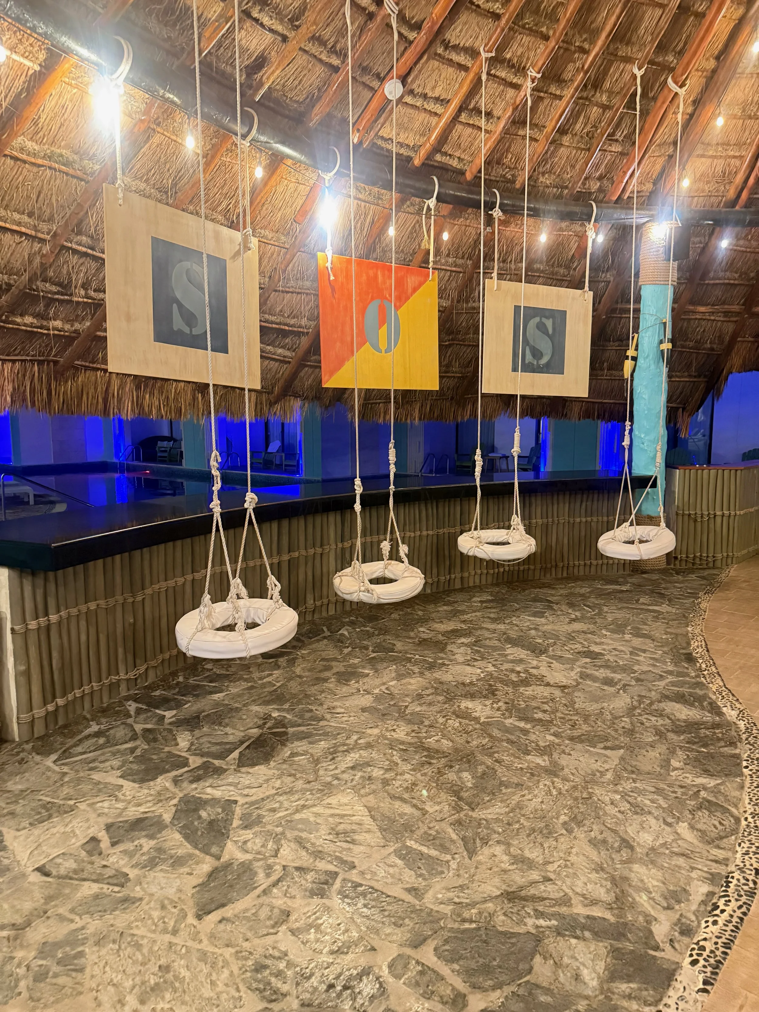Hanging Life Ring Seats at SOS Bar at Margaritaville Island Reserve Riviera Cancun