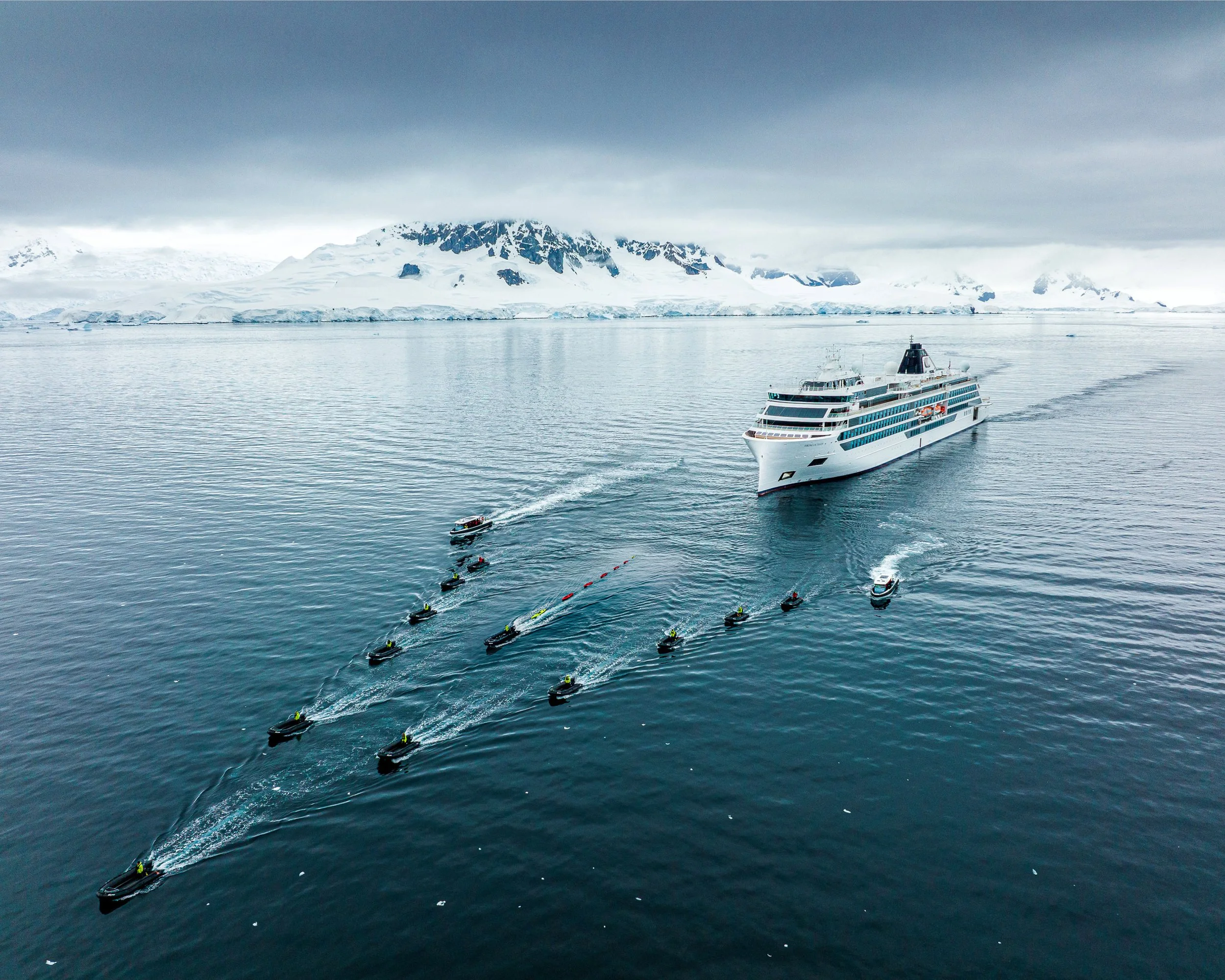Viking Expedition ship navigating Antarctic waters with zodiac landing boats