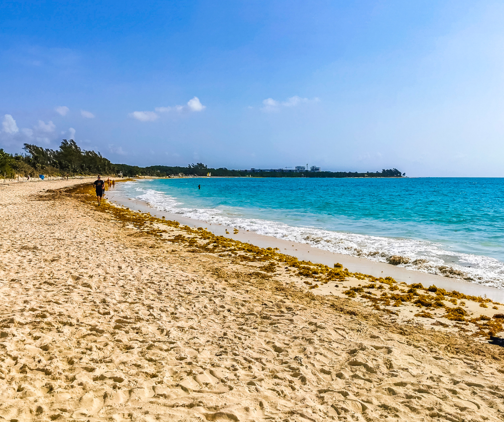 Quiet white-sand beach and turquoise Caribbean waters in Runaway Bay, Jamaica.