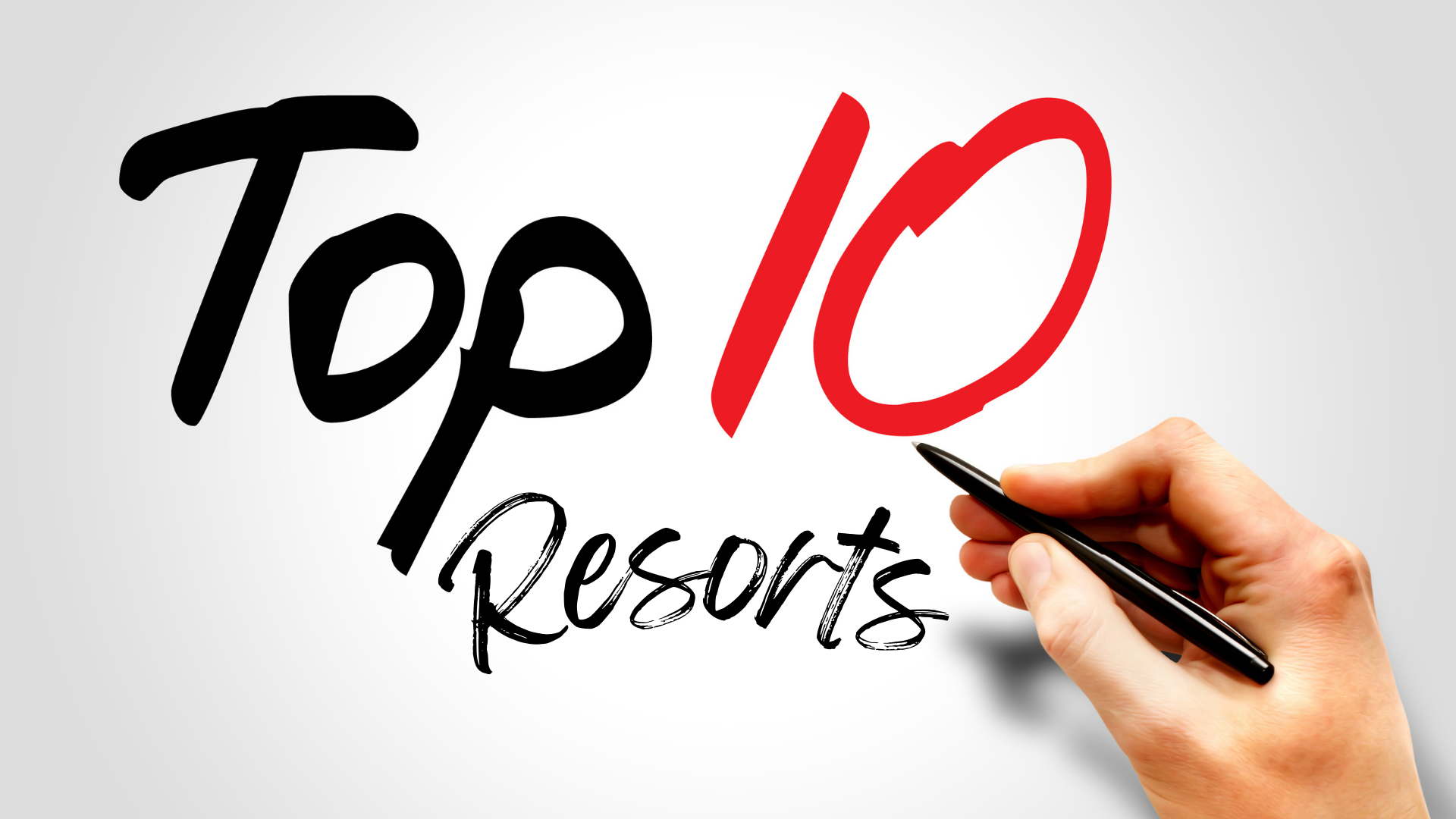 Close-up of a person's had holding a pen writing the words "Top 10 Resorts" on a notepad