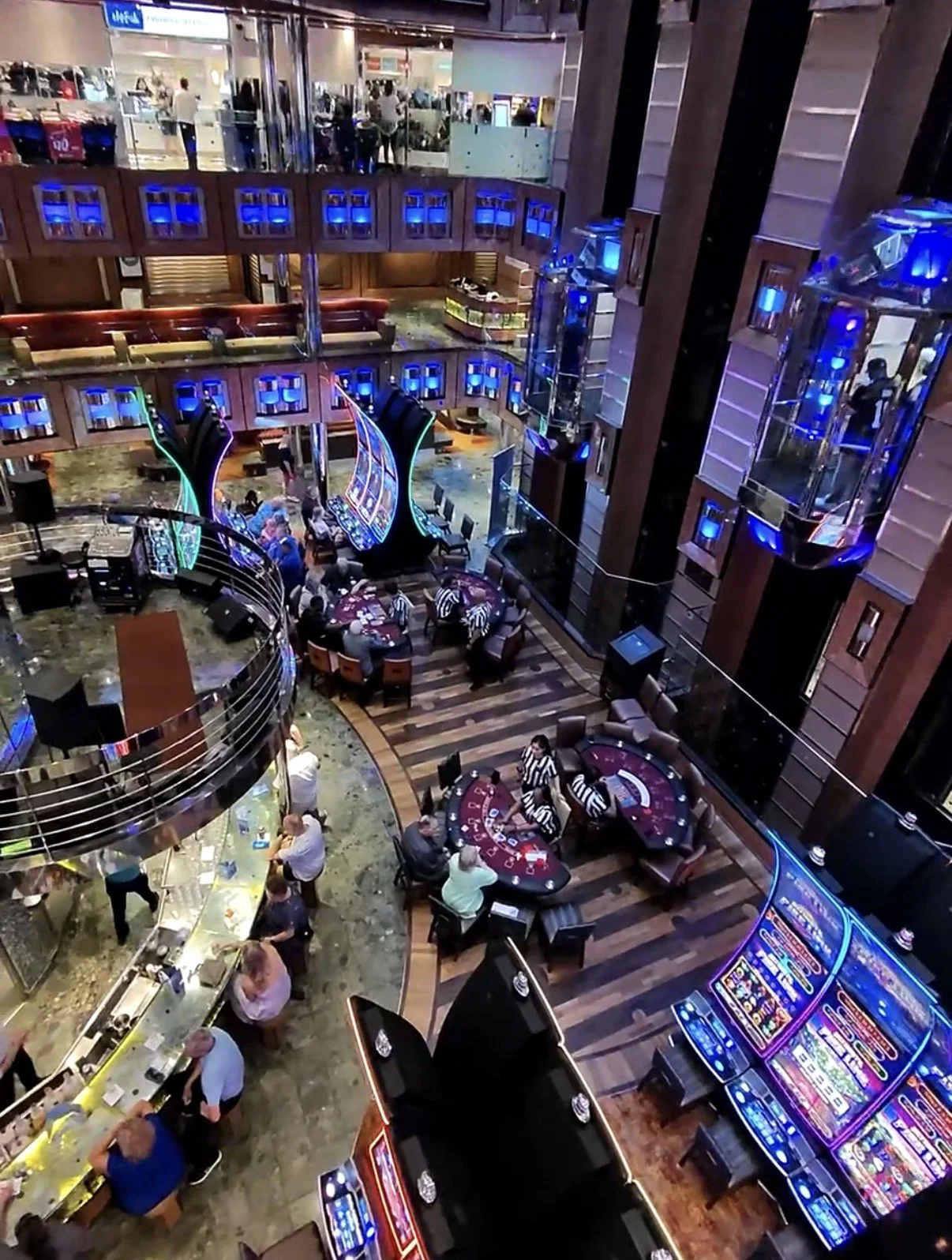 Expanded casino areas on Carnival SEA Cruise with slot machines and table games throughout the ship