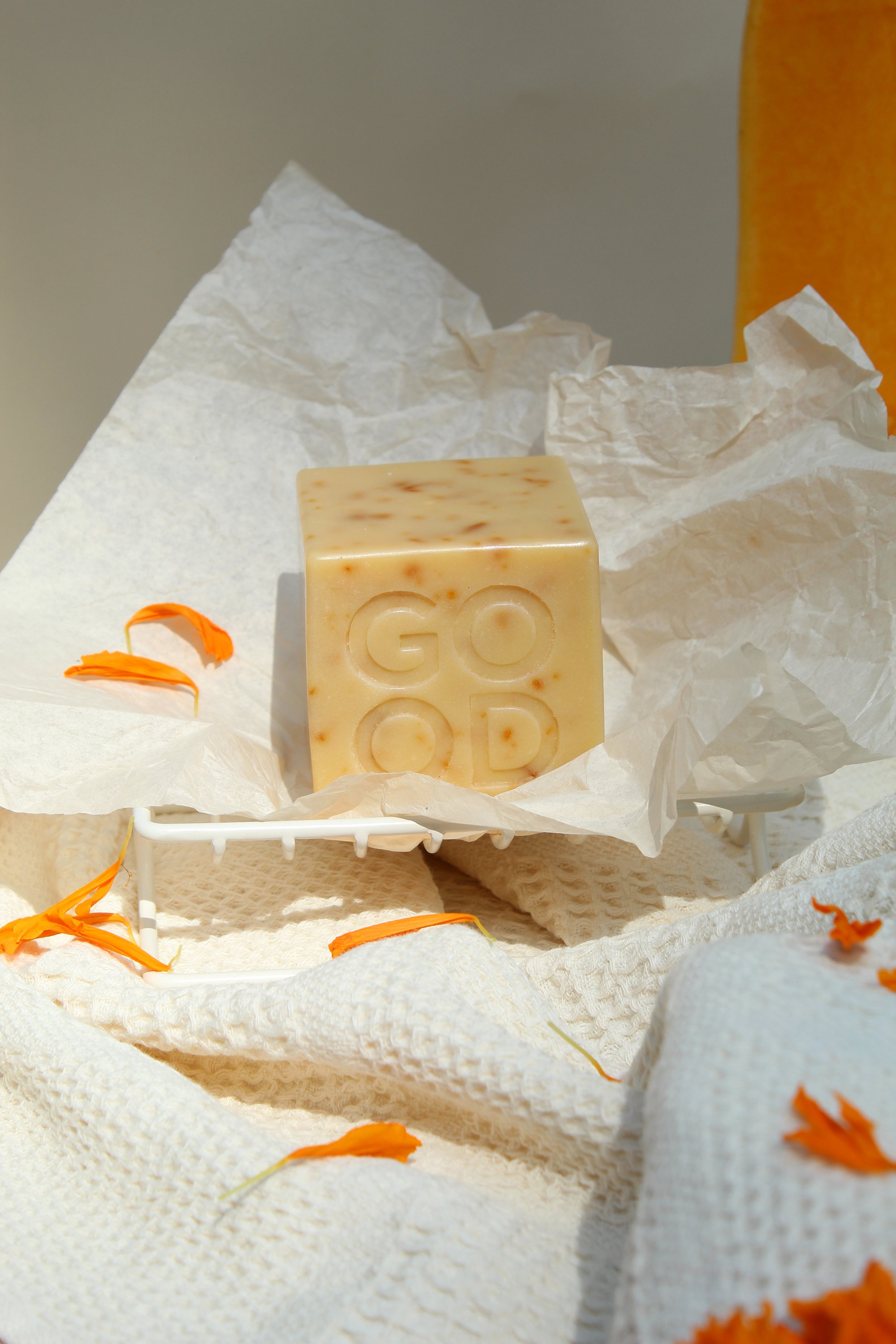 Good_Rhubarb_Marigold_Butternut_Soap_marigold_petals_onwhite_waffle_towels_in_coated_wire_enamel_Saop_tray.jpeg