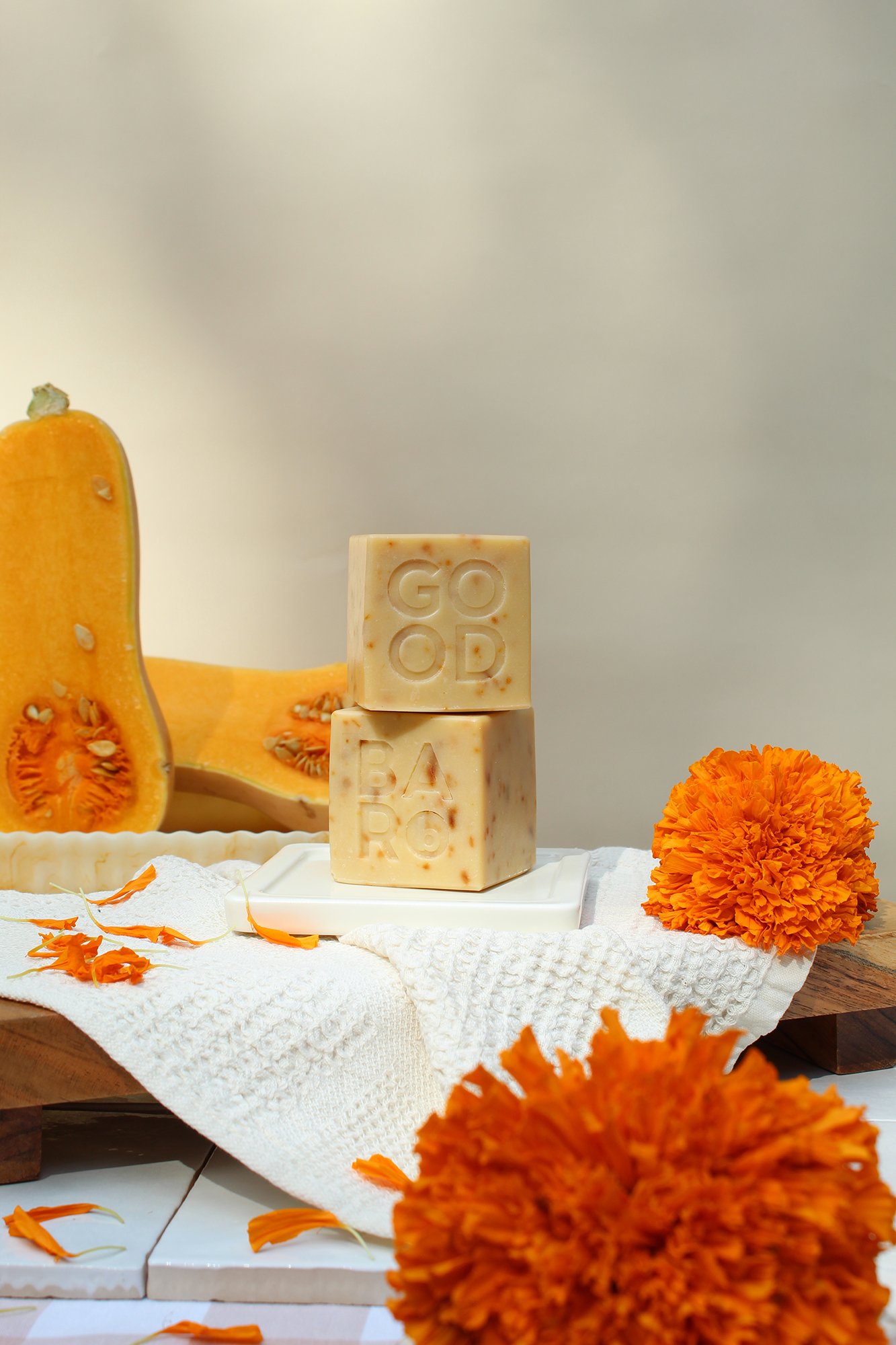 Good_Rhubarb_Marigold_Butternut_Soap_Stack_w_Squash_Flowers_waffle_Linens.jpeg