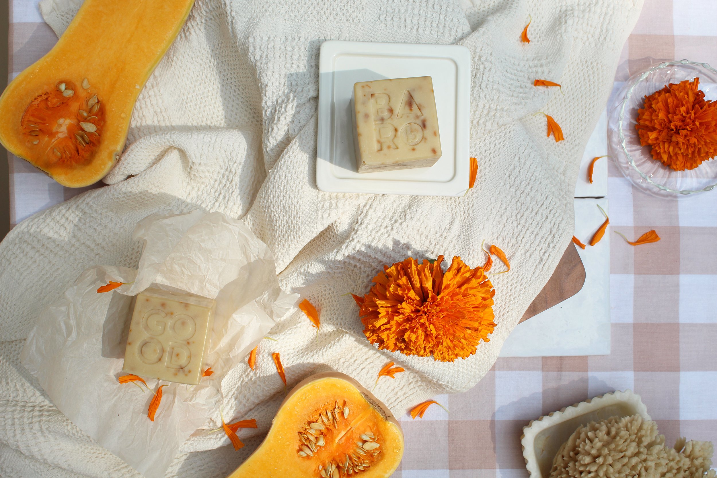 Good_Rhubarb_Marigold_Butternut_Soap_Flatlay_w_Cut_Squash_Flowers_Waffle_Linens.jpeg