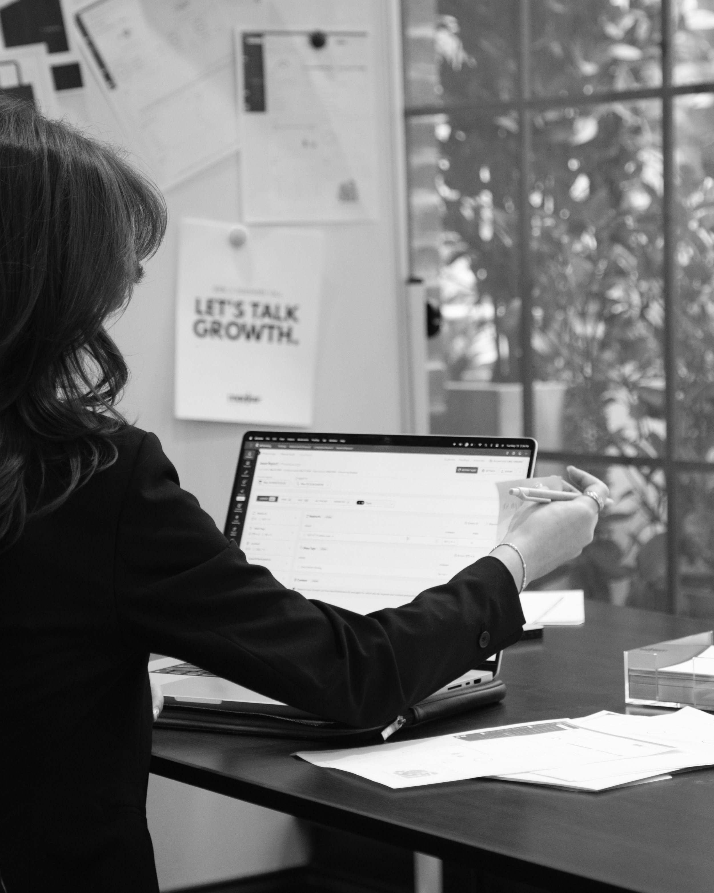 Kay Walker planning a website strategy at a laptop.