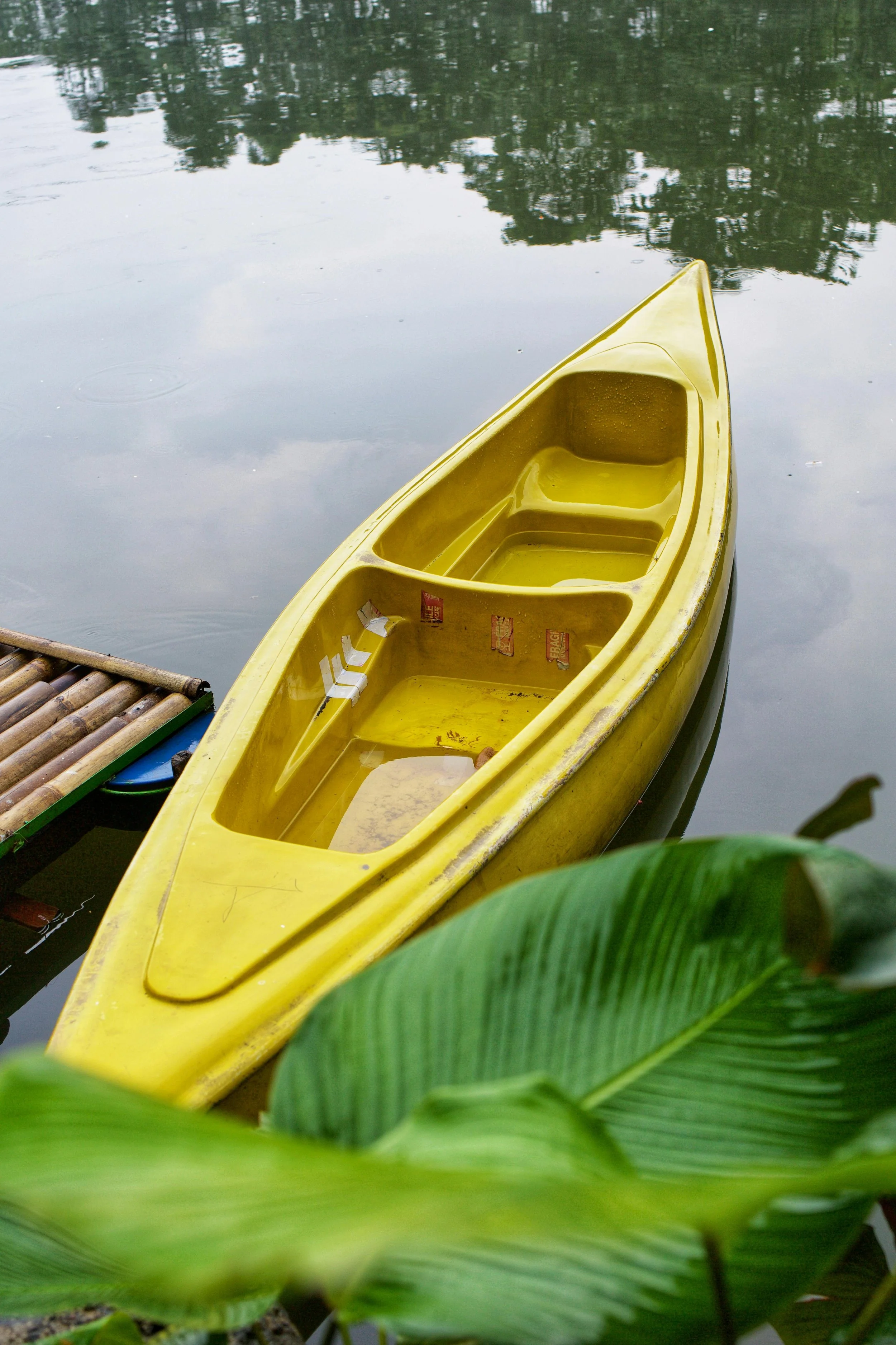 Photo by Heru Dharma: https://www.pexels.com/photo/yellow-canoe-docked-on-peaceful-lake-shore-32935251/