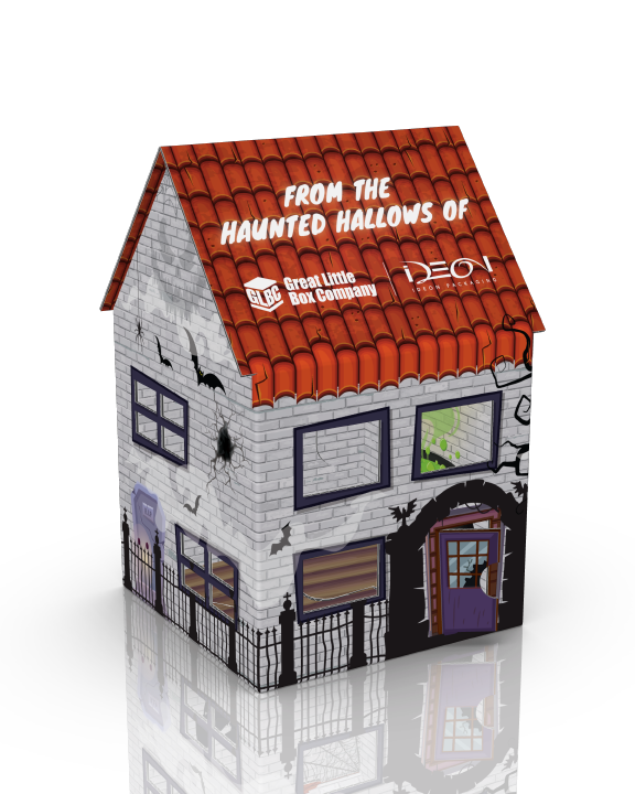 A cardboard haunted house Halloween decoration with brick pattern, red tiled roof, purple door, spooky window designs, bat and spider decals, and Halloween themed text on the roof.