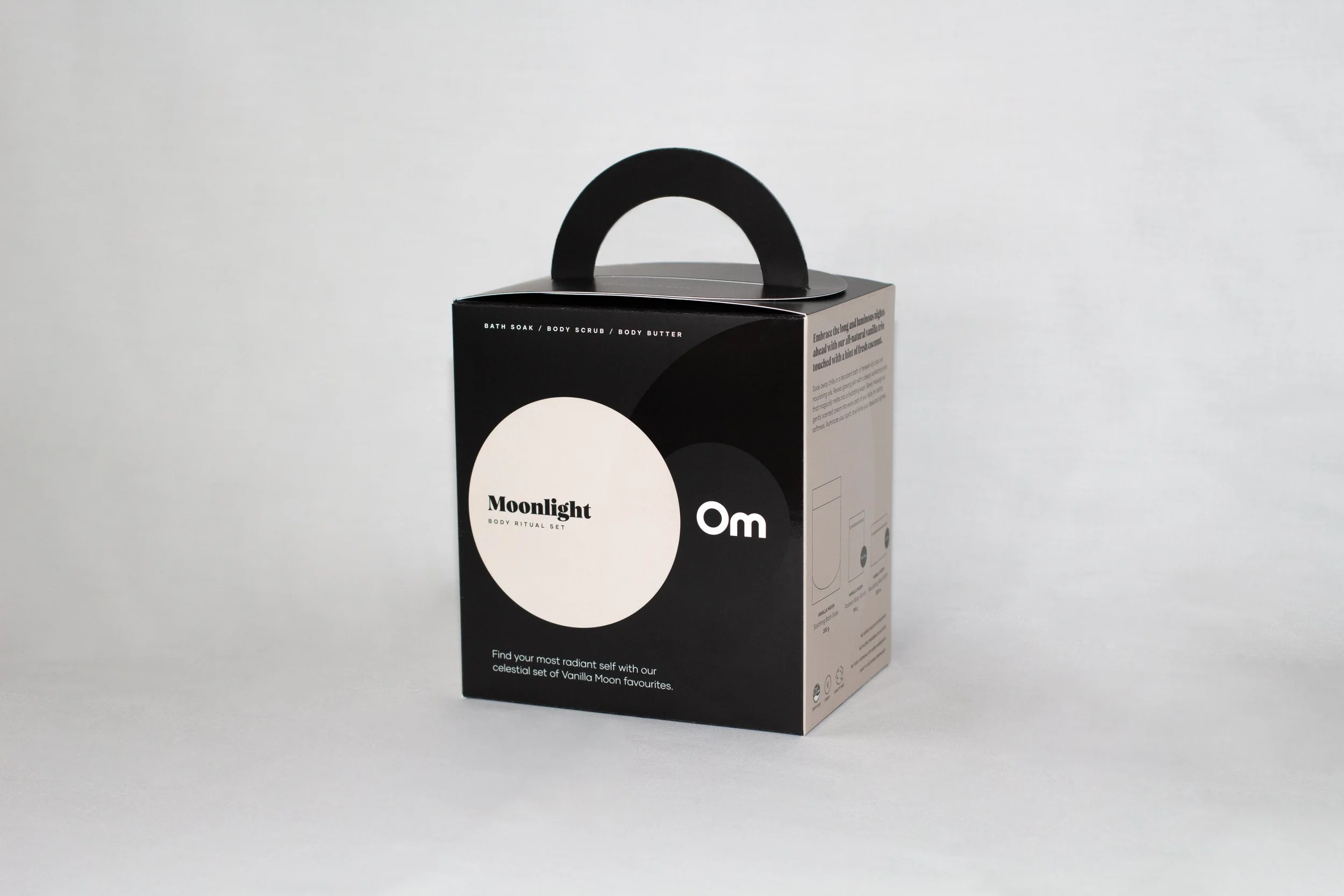 A black box with a handle on top, labeled 'Moonlight' body ritual set, with additional text describing bath soak, body scrub, and body butter inside.