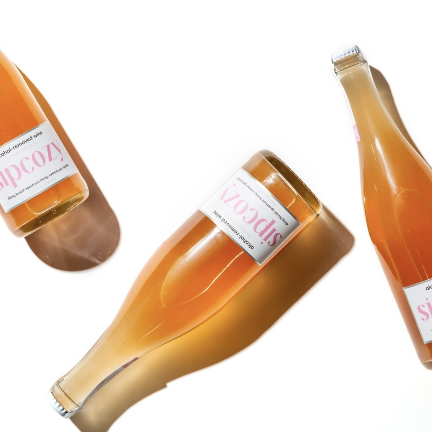 Three bottles of alcohol-free sparkling wine labeled 'Sipcozy,' placed on a white background.