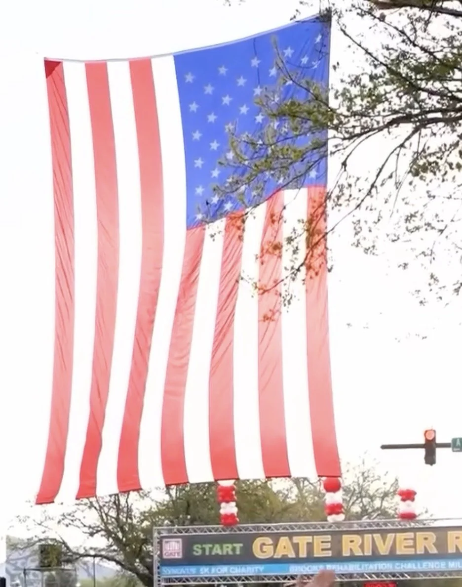 American flag hanging over the start line of the Gate River Run