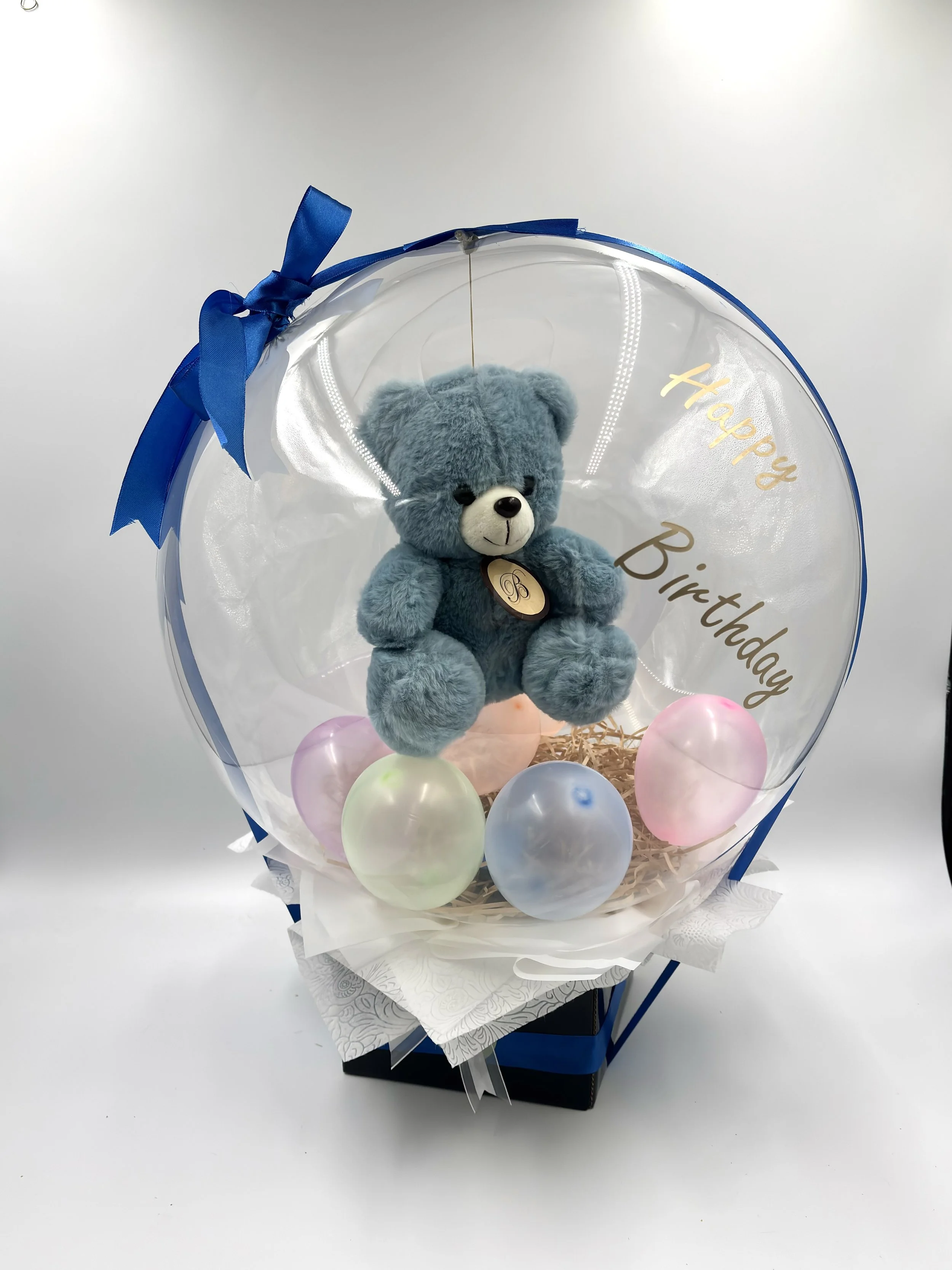 HAPPY BIRTHDAY BALLOON
Adorable Ballon Box with a soft plush blue or pink teddy bear, and small balloons within—a charming celebration gift, handcrafted by The Bouquet Bar Adelaide. (Click on Image to Enquire.)

