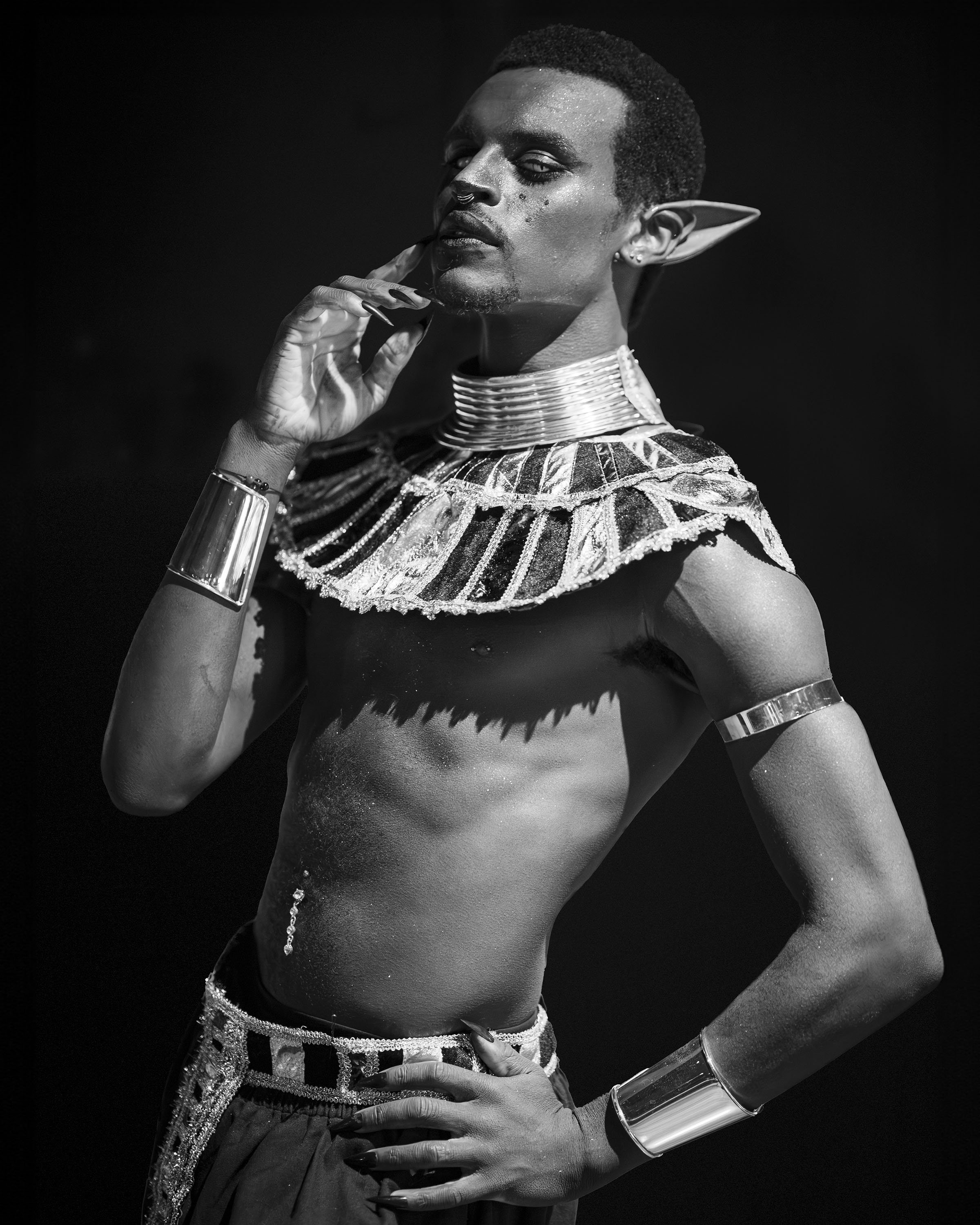Person photographed by Maryland portrait photographer, dressed in costume with elven ears and metallic accessories.