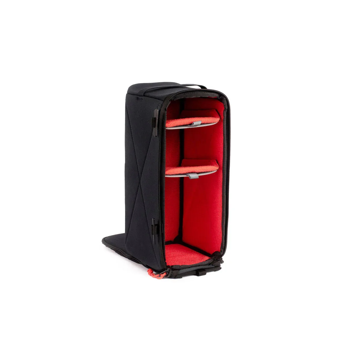 Open black and red camera or equipment bag with padded compartments.