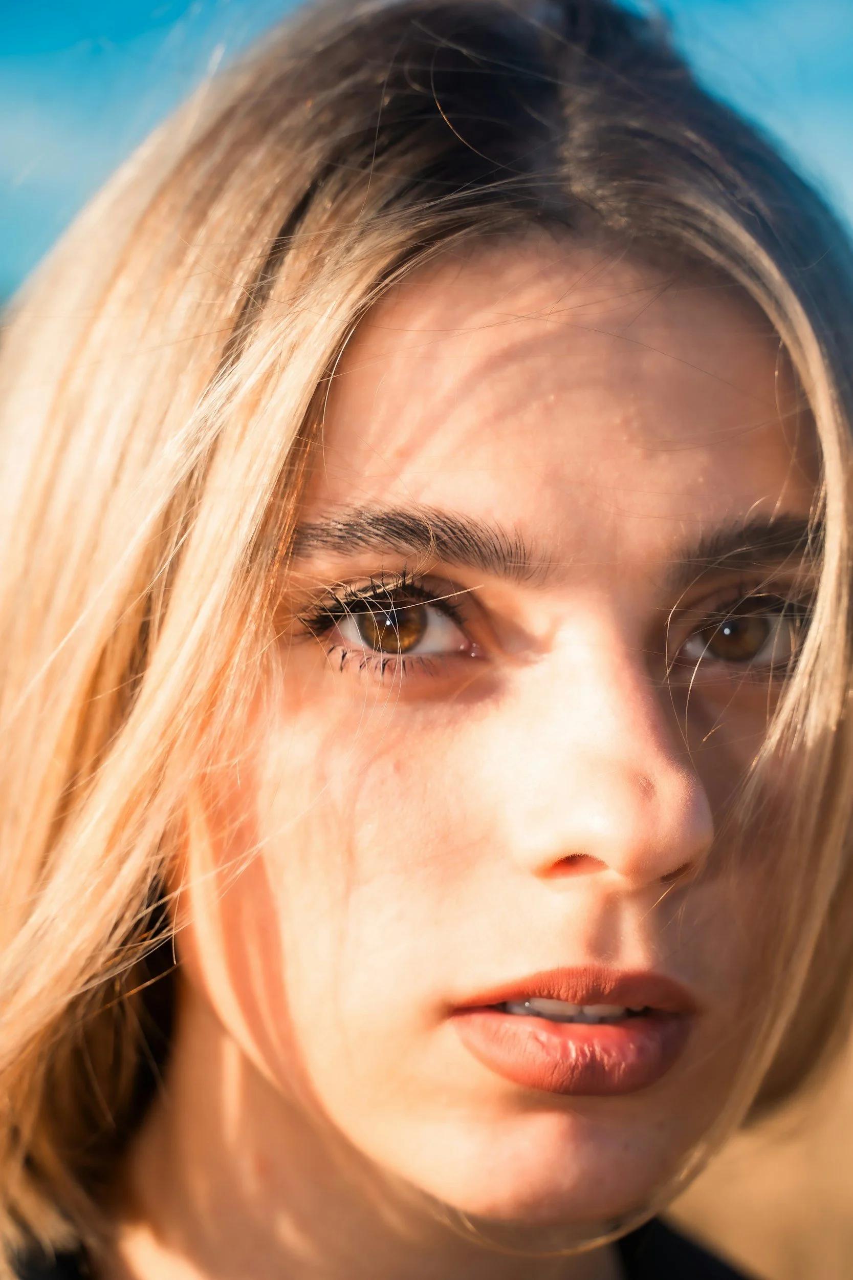 an iamge of a woman with light streaming on her face