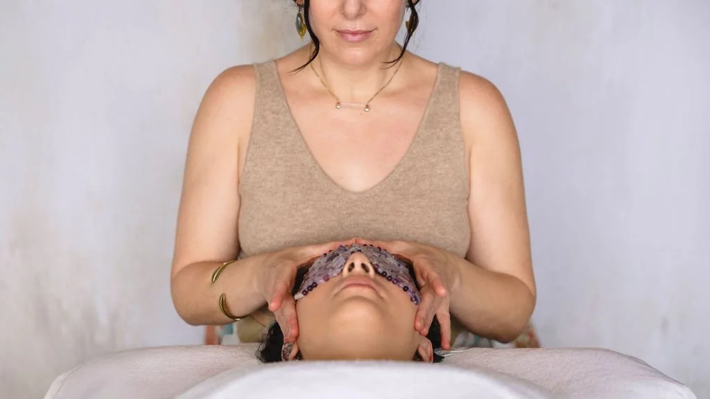 an iamge of an esthetician performing a $1000 facial