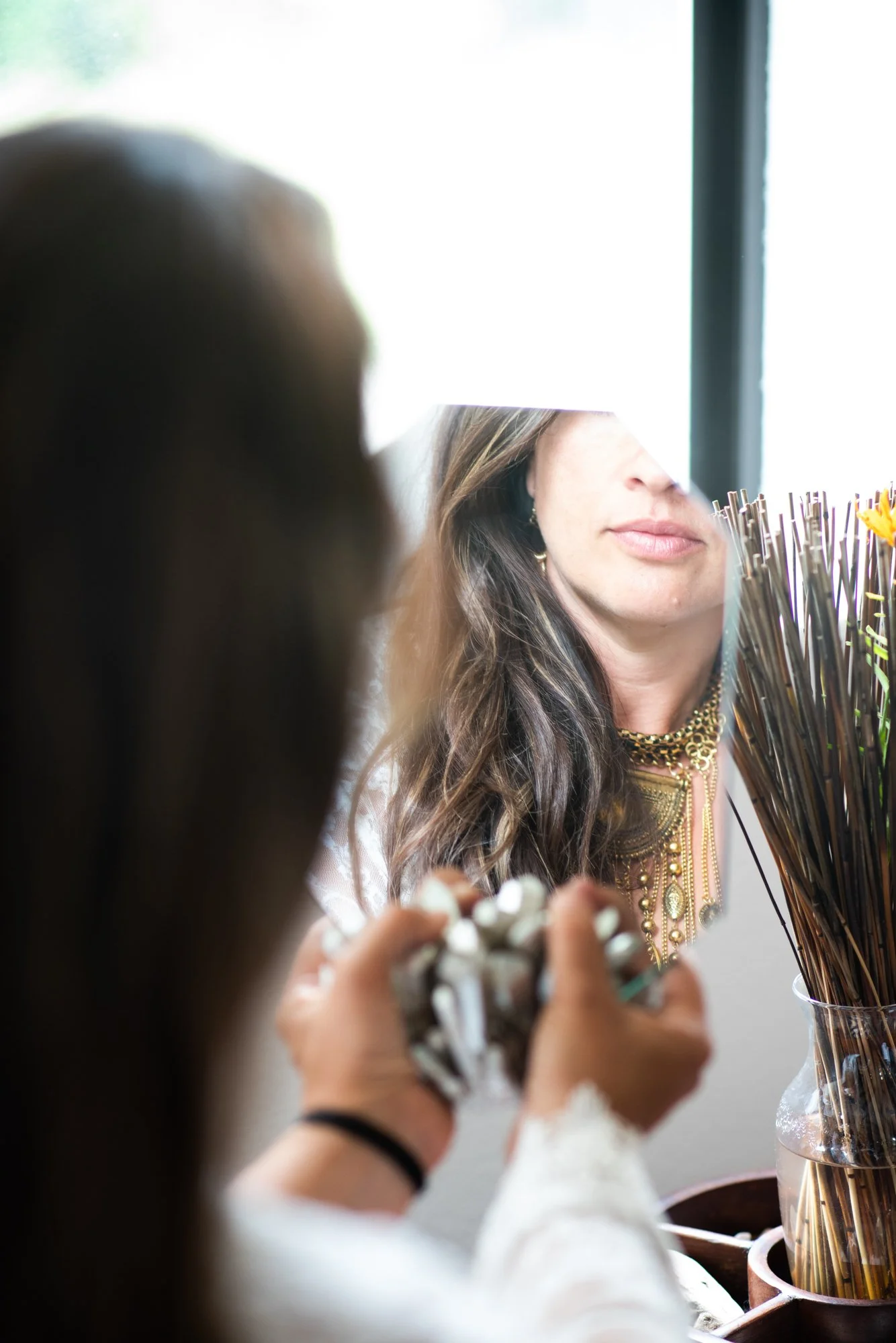 An image of a client looking into a mirror