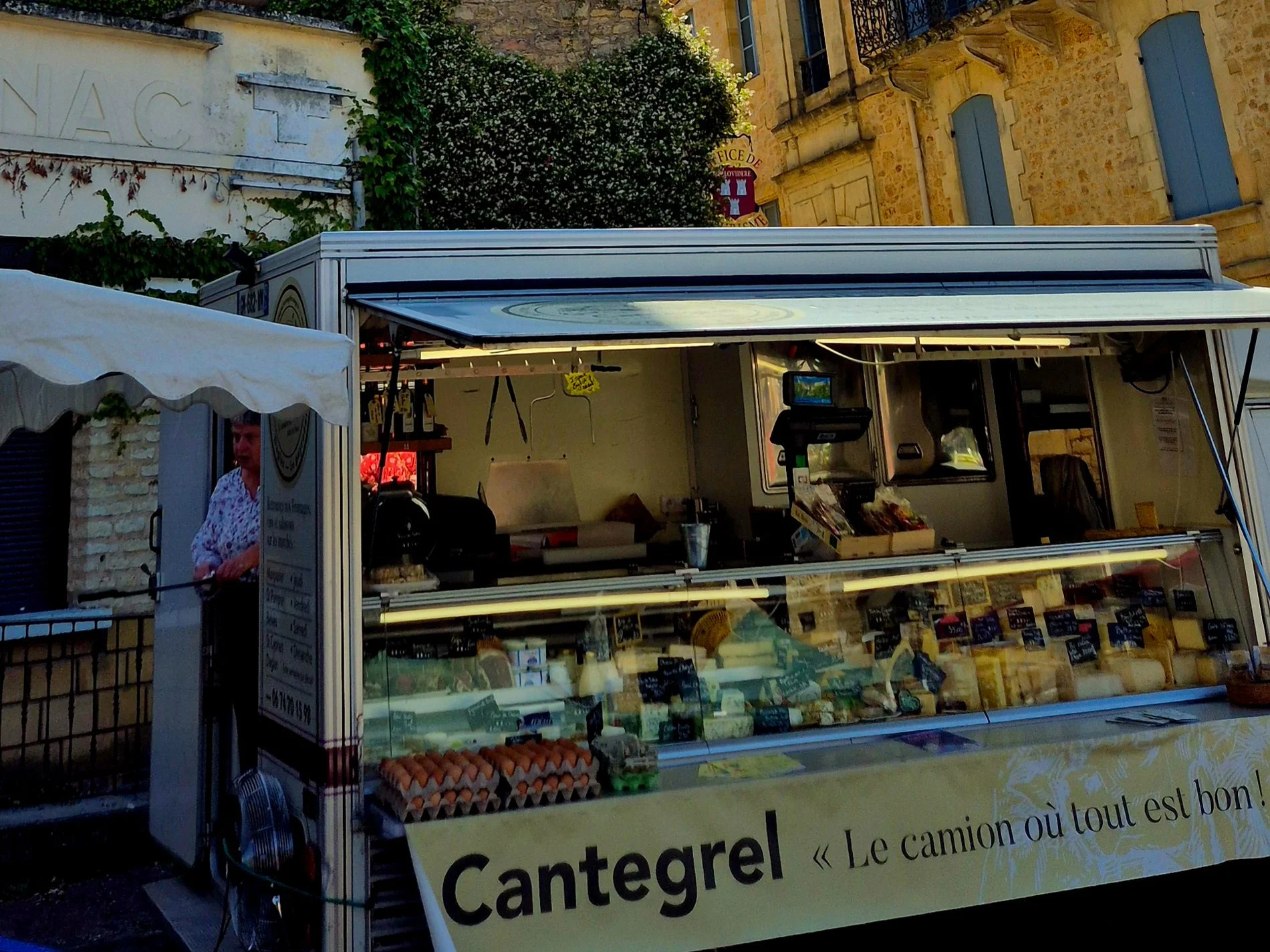 a picture of cantegrel cheese stand at belves market