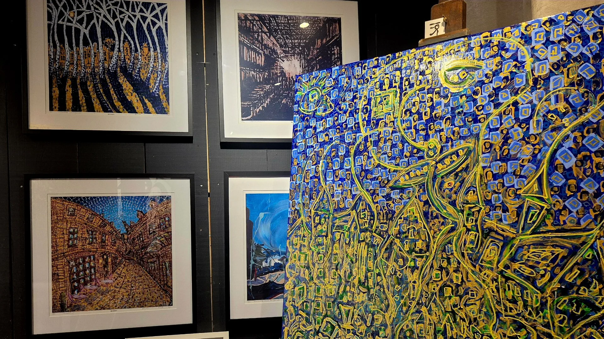 impressionist paintings by naz hussey on the gallery wall in the studio in belves