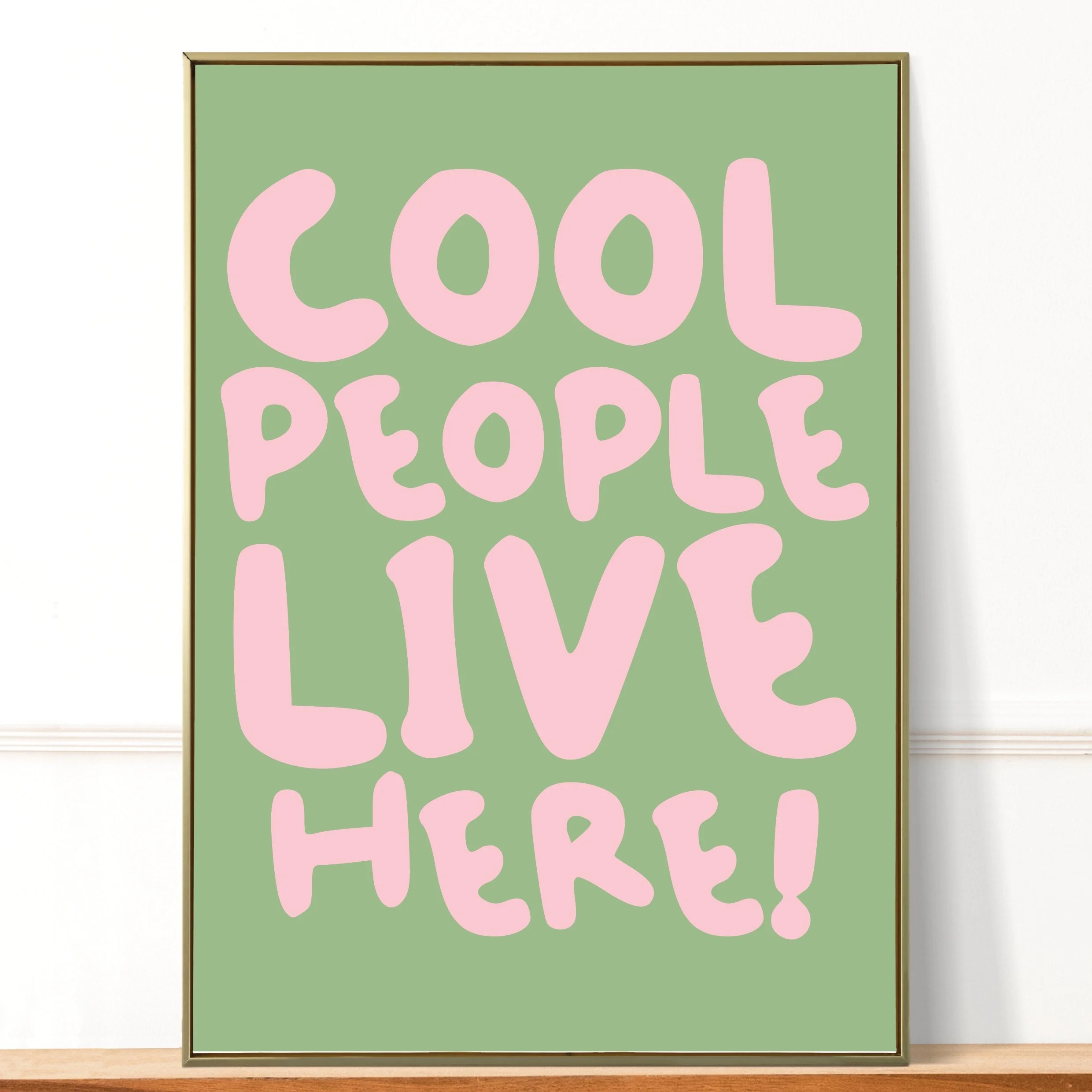Poster with the phrase 'Cool People Live Here!' in pink letters on a green background.