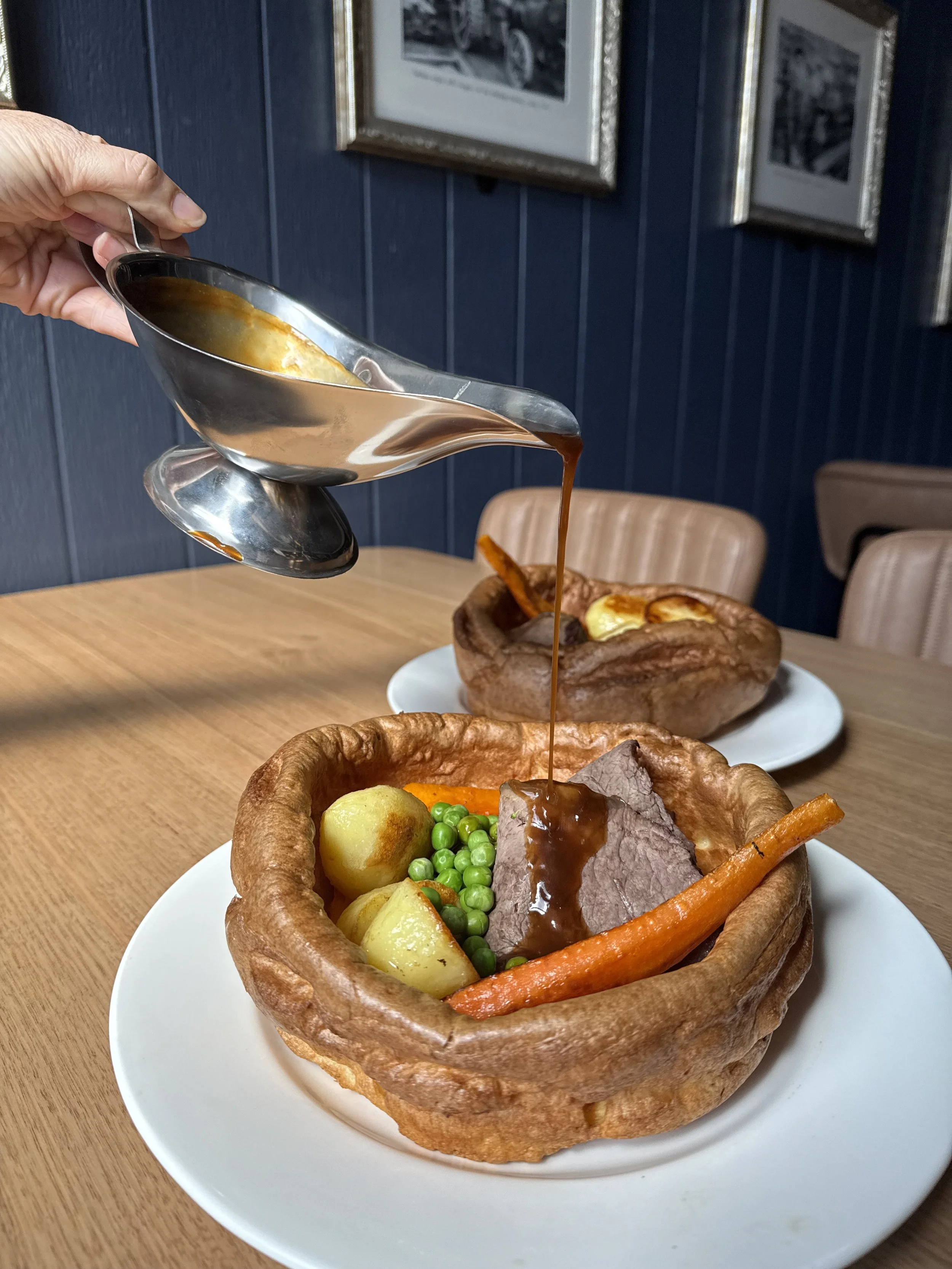 The Big Yorkie - giant Yorkshire pudding filled with roast beer, roast vegetables, peas and gravy.