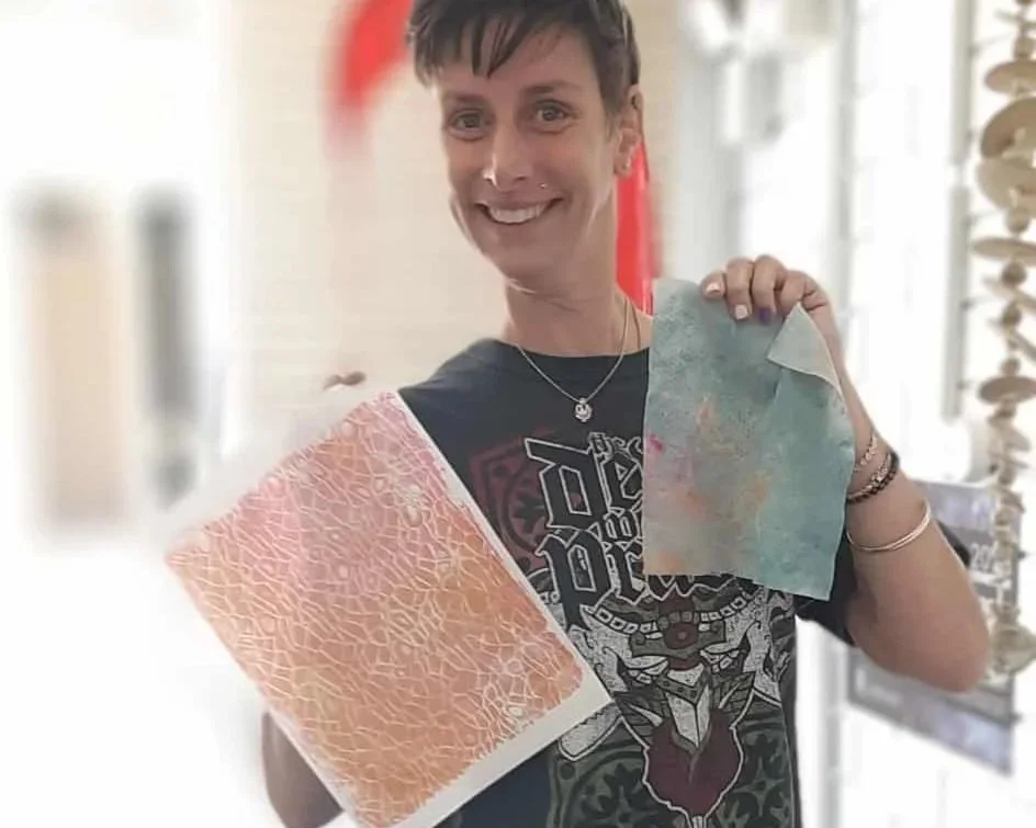 A mountain peak during sunset or sunrise with an orange sky.