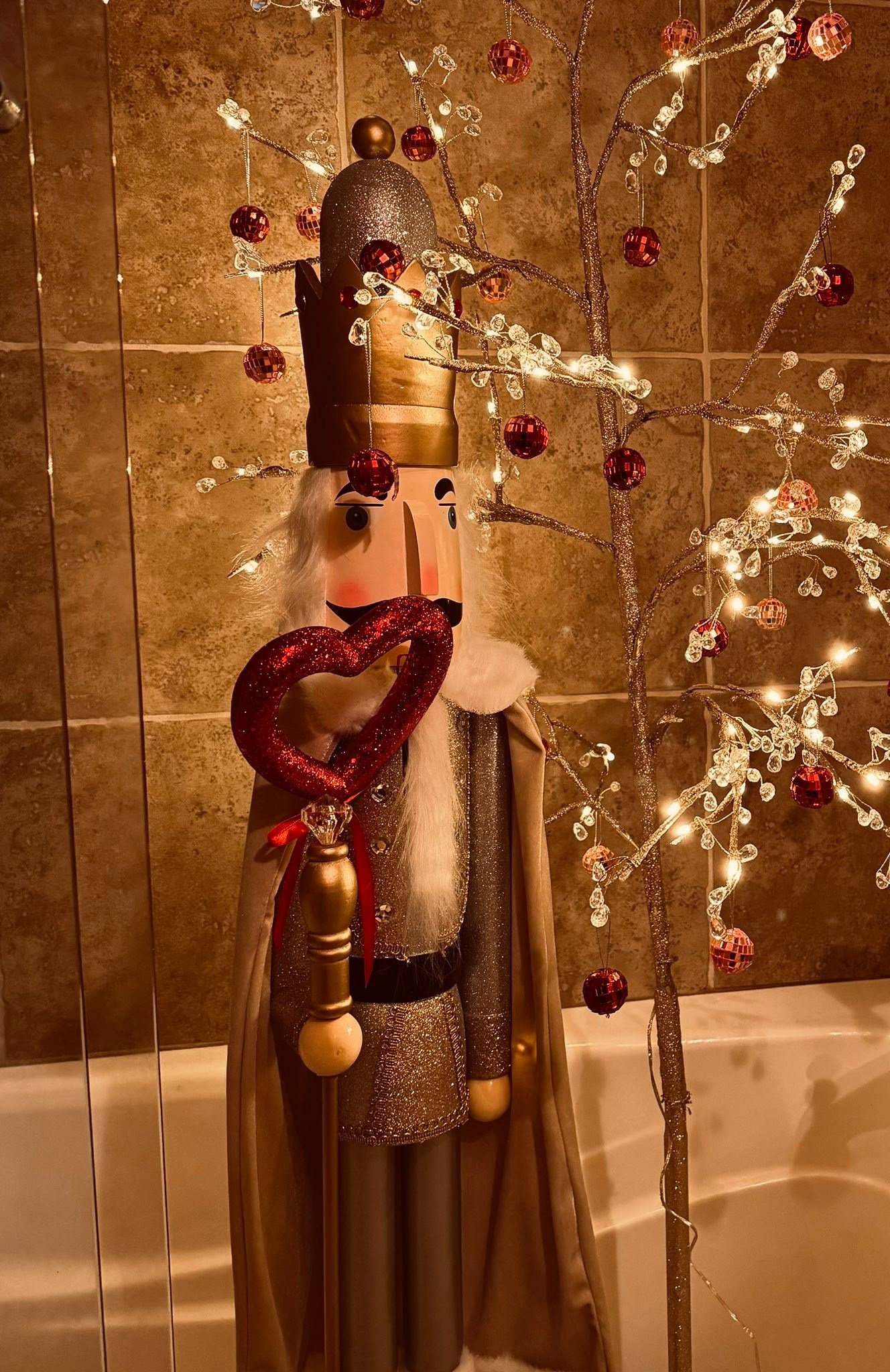 While the rest of my Christmas decorations came down on January 8th, I was not ready to un-sparkle our guest bathroom. I decided to convert my lit tree and nutcracker in the tiled shower and the bathroom bouquet to a valentines theme! I like it. With