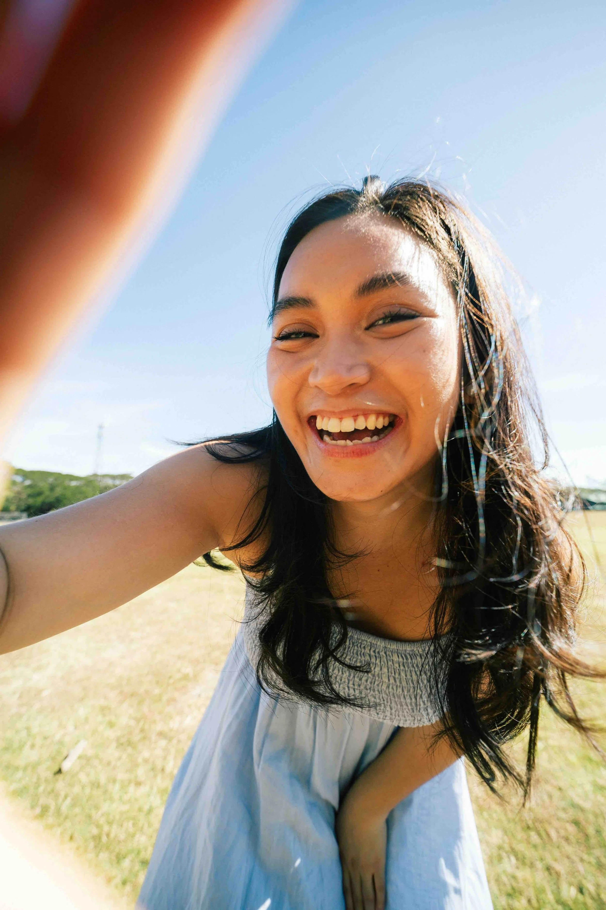 Sunnyside Welcome illustration of a young woman smiling outdoors