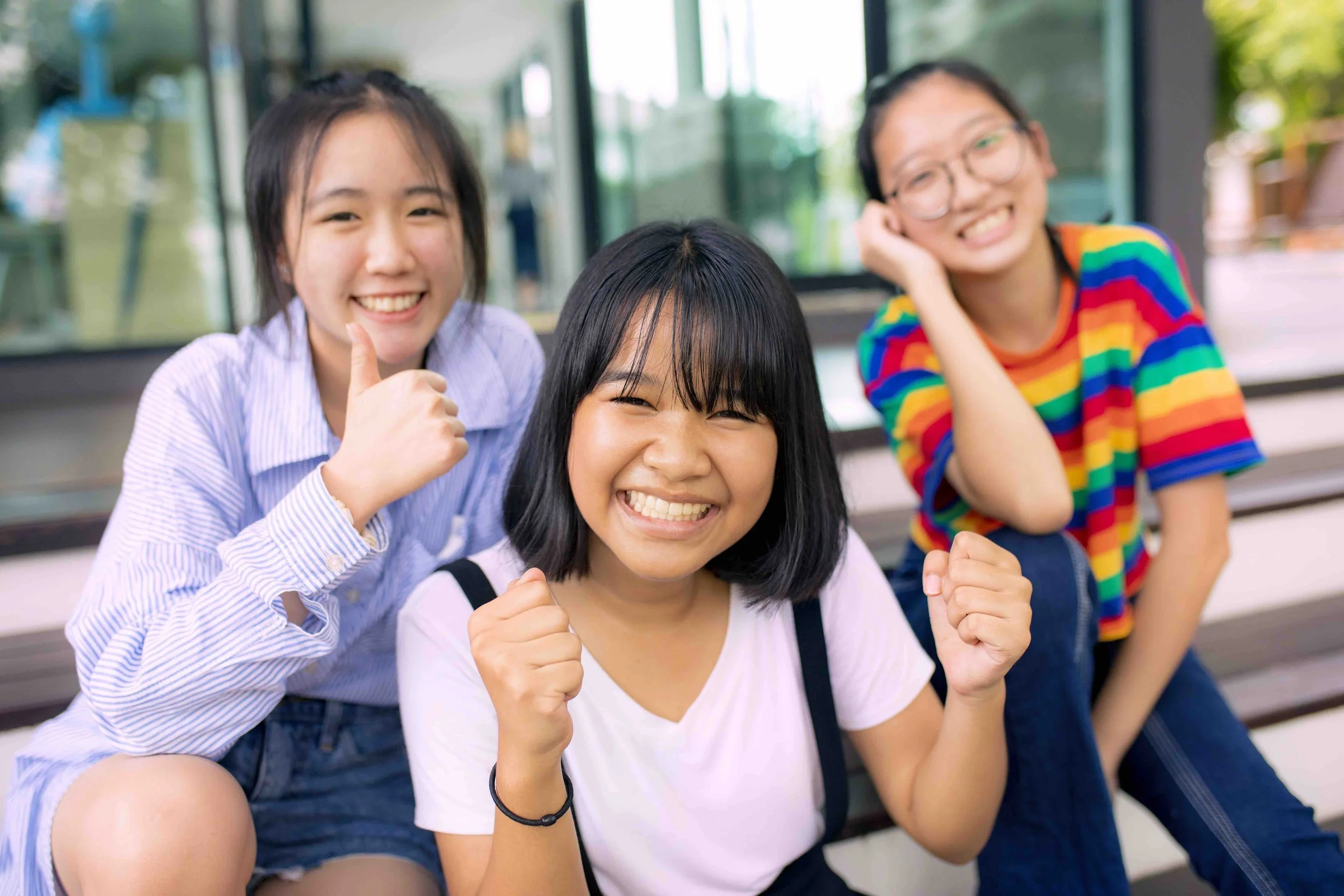 Sunnyside illustration of three girls smiling together outdoors