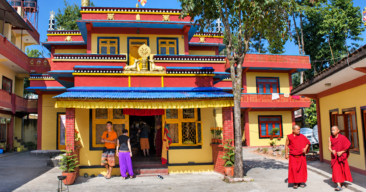 Yellow and red buildings surrounding the courtyard of Shree Gaden Dhargyaling Monastery in Pokhara, Nepal.